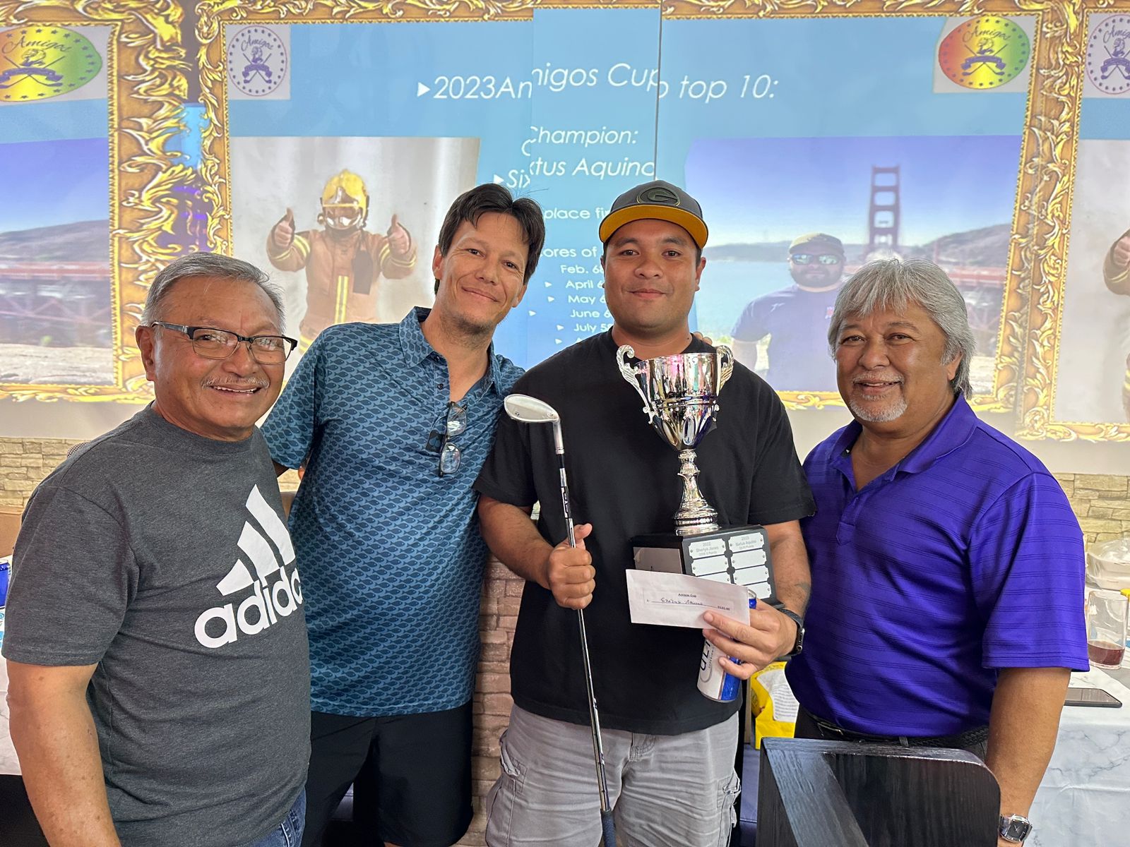 Sixtus Aquino, 2nd right, poses with the 2023 Amigos Cup trophy and Amigos Golf Club officers during the awards banquet of the 2023 Amigos Golf Club Ace of Aces tournament at Party & Beyond Restaurant.