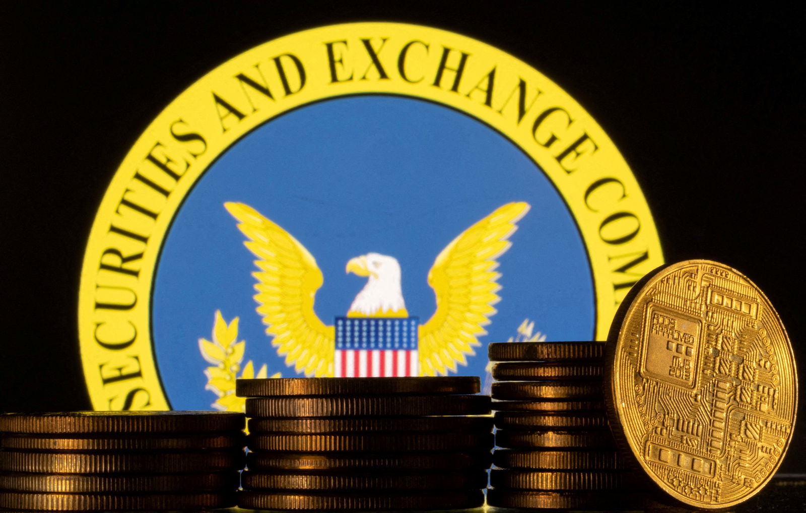 U.S. Securities and Exchange Commission logo and representations of cryptocurrency are seen in this illustration taken June 6, 2023. 