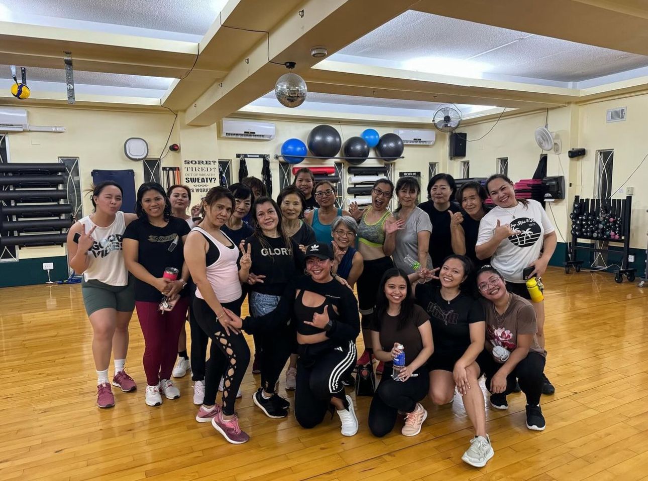 If you want to catch Rhine Russel's Zumba class, meet her at Gold's Gym on Mondays and Wednesdays at 6 p.m. She's pictured here kneeling, wearing a black cap.