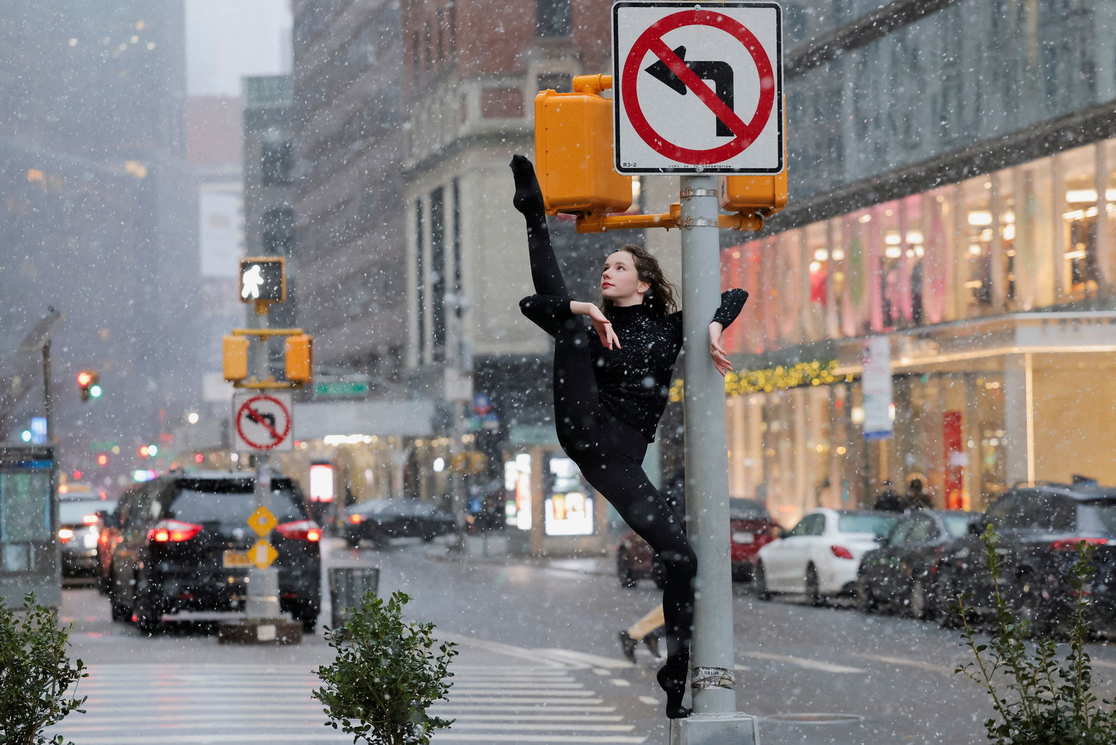 Dancer Skye Madison Murphy poses for a photographer as snow falls in New York City, U.S., January 6, 2024. 