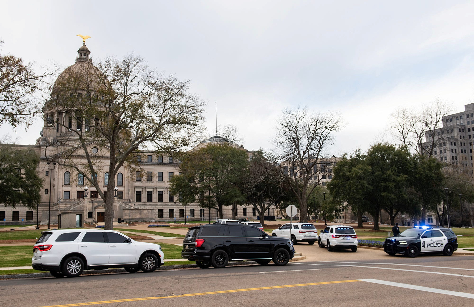 Law enforcement vehicles are deployed at the Mississippi State Capitol after a bomb threat was received in Jackson, Mississippi, U.S. January 3, 2024. 