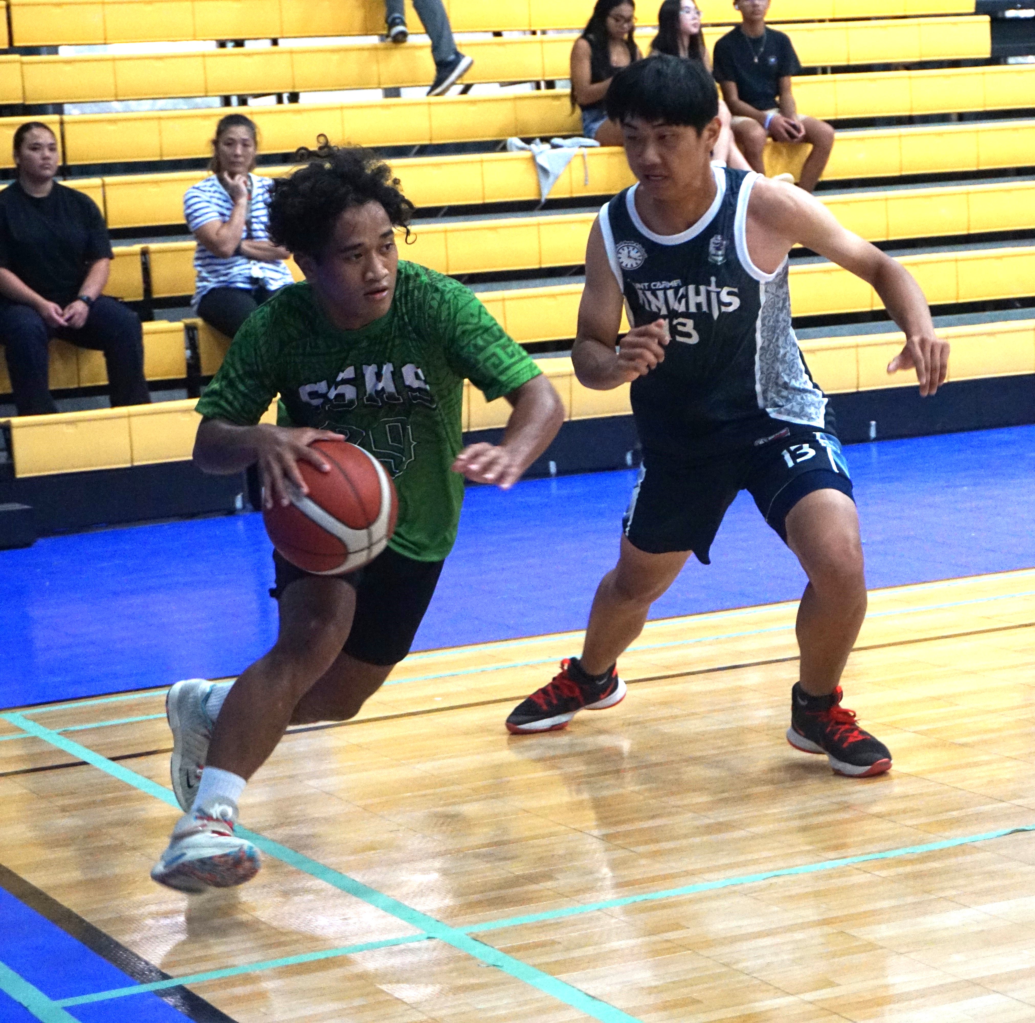 SSHS' Rasg Andon attempts the baseline drive during a boys high school division game of the IT&E Interscholastic Basketball League at the Ada gym on Wednesday.