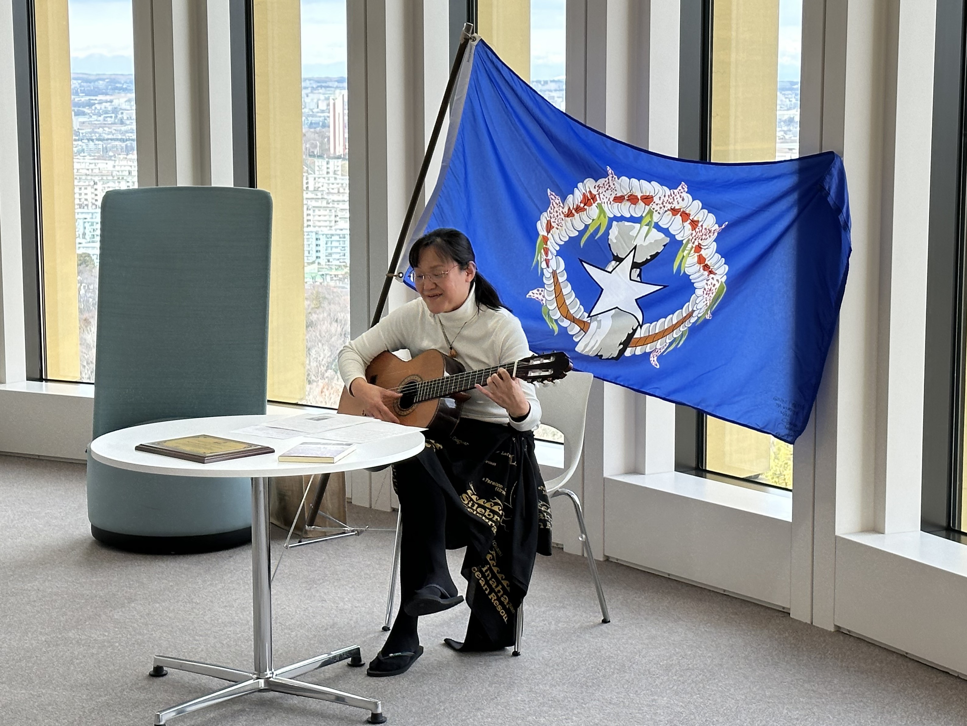 Marianas  Honorary  Tourism  Ambassador  Kyoko  Nakayama  performs an  original  composition  in  the Chamorro language on Jan. 23, 2024, at Teikyo University in Tokyo, Japan. 