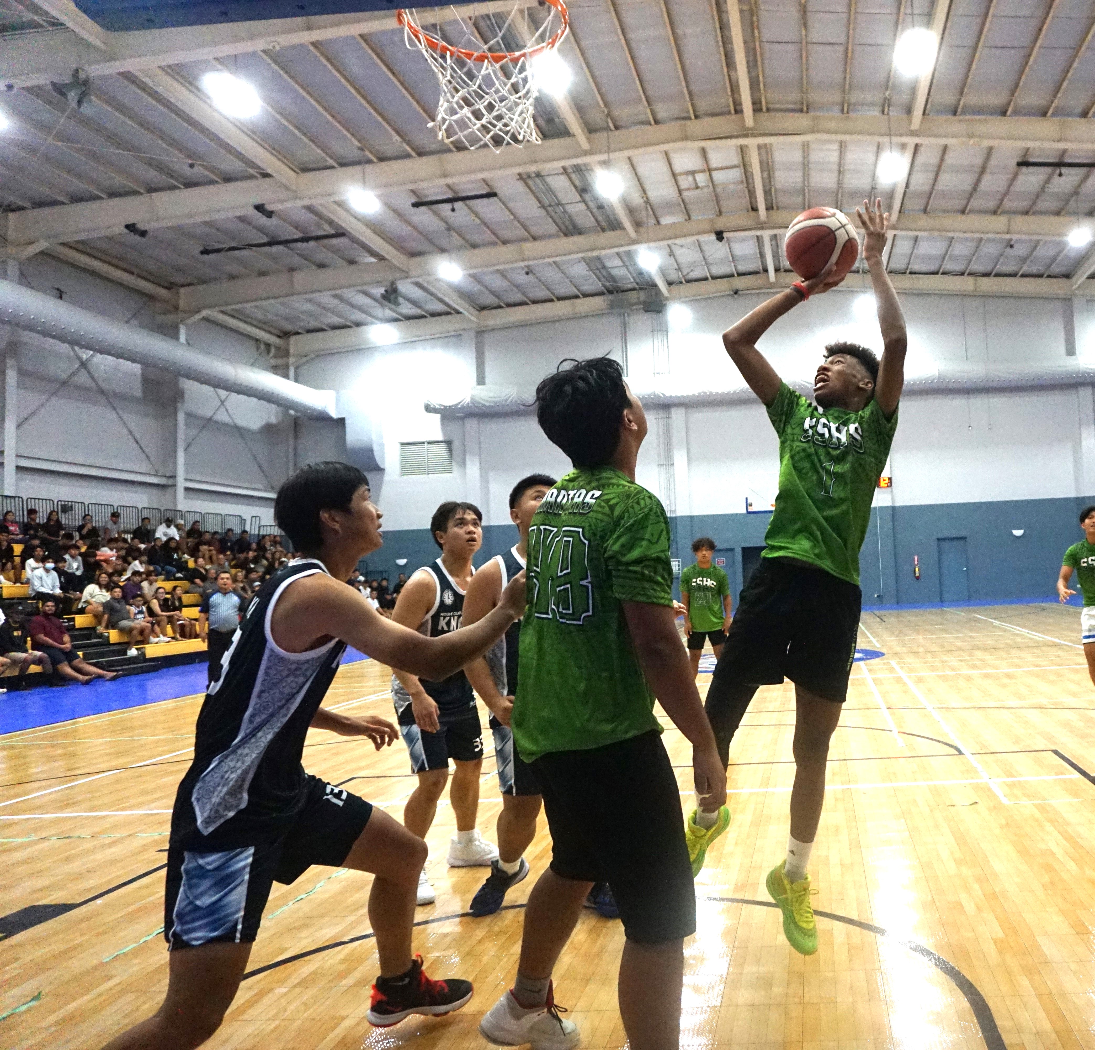 SSHS' Kian Helgen takes the fadeaway jumper during a boys high school division game of the IT&E Interscholastic Basketball League at the Ada gym on Wednesday