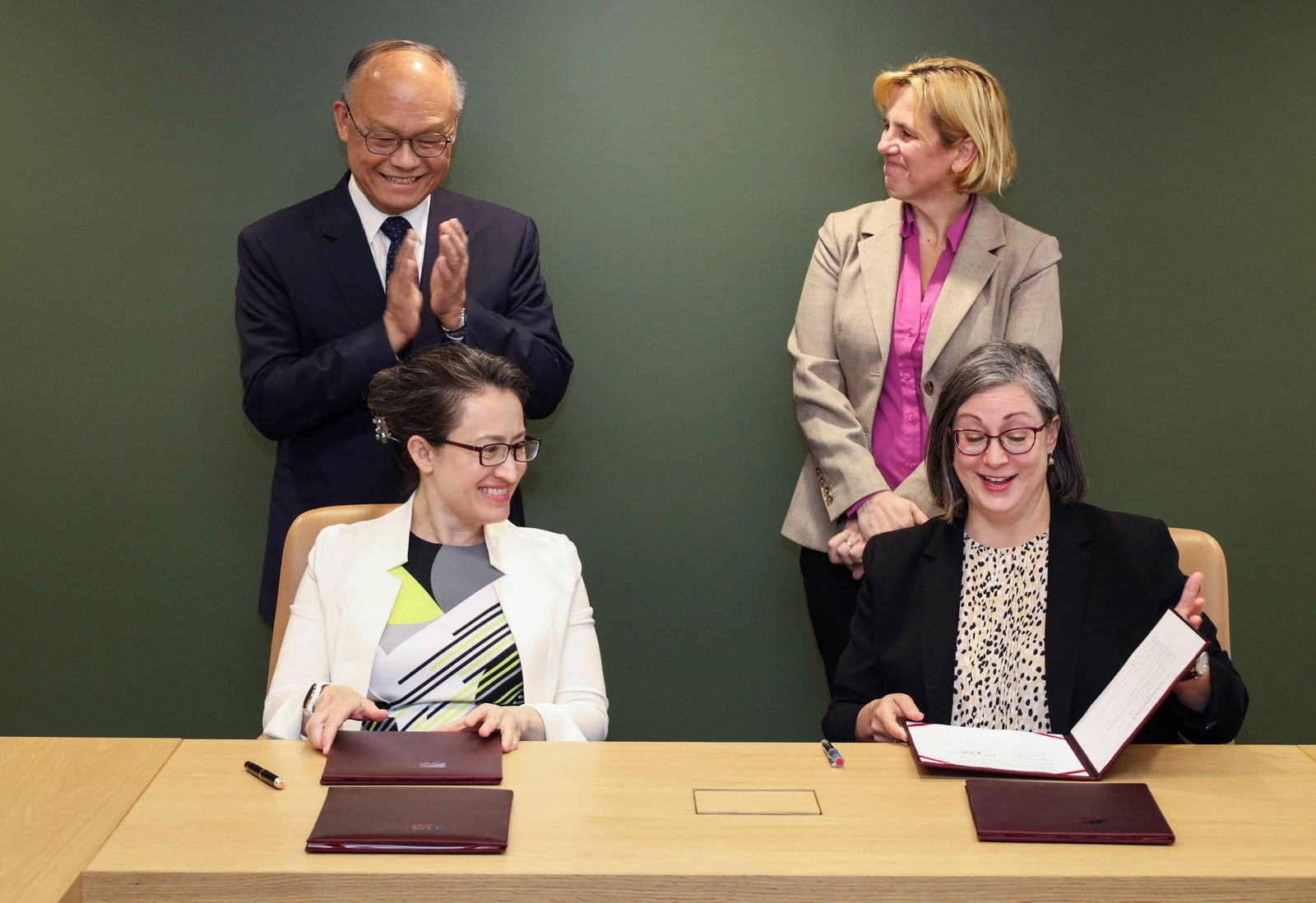Taiwan Trade Minister John Deng applauds next to Deputy U.S. Trade Representative Sarah Bianchi as Taiwan's Ambassador to the U.S. Hsiao Bi-khim and Ingrid D. Larson, managing director of the American Institute in Taiwan's headquarters, sign the first deal under a new trade talks framework during a signing ceremony at the American Institute in Taiwan, in Arlington, Virginia, U.S., June 1, 2023. 