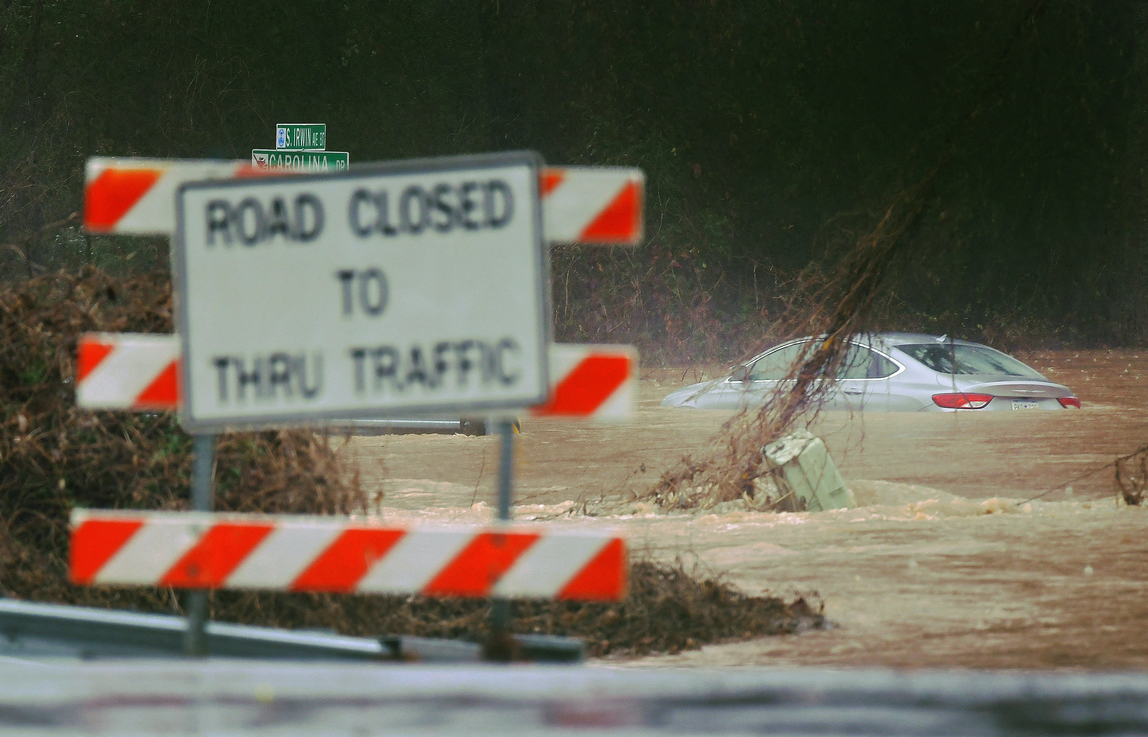 A car lies in flood waters after heavy rainfalls moved in through the area of Spartanburg, South Carolina, U.S. January 9, 2024. 