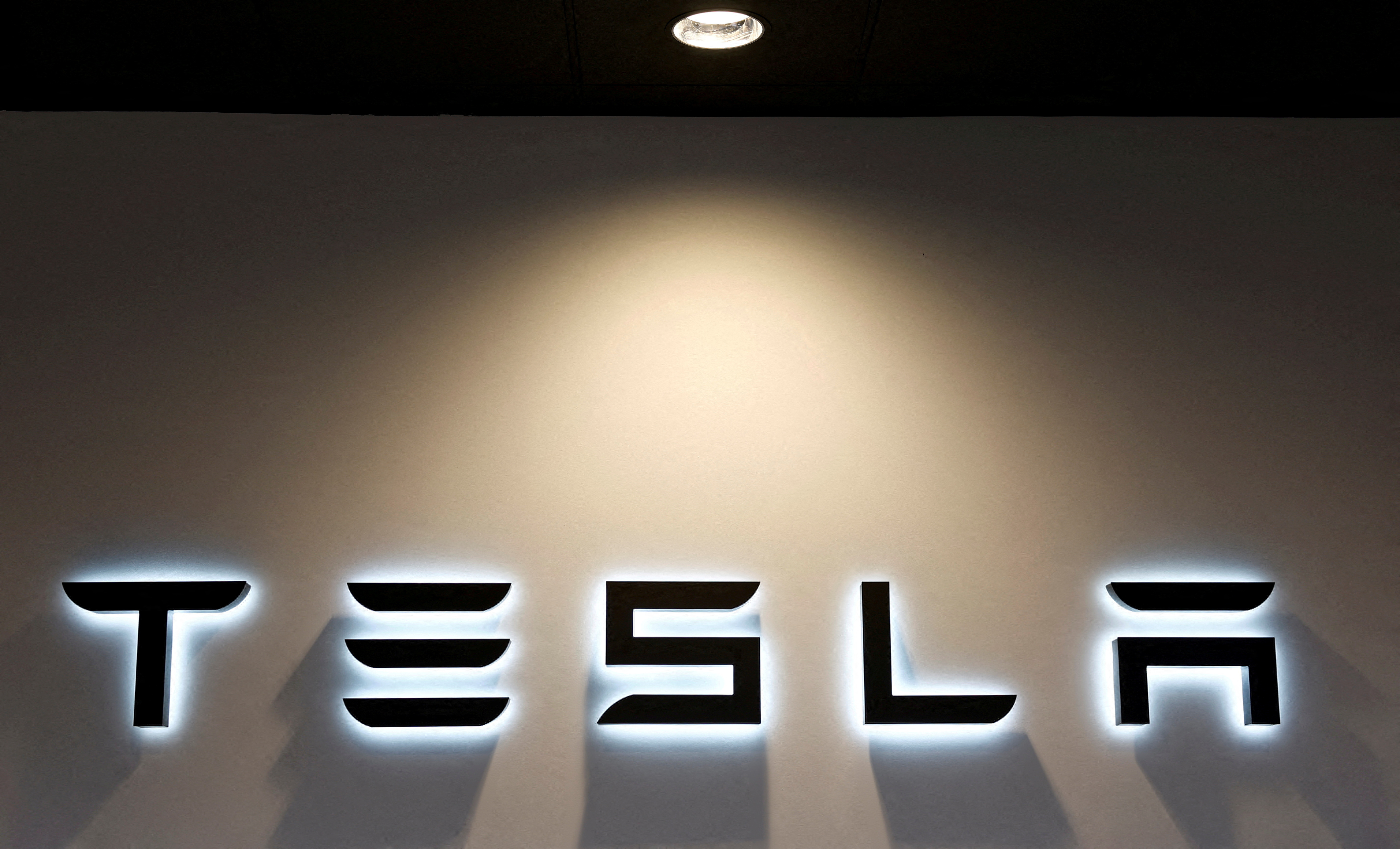 The Tesla logo is seen at a dealership in Durango, northern Spain, October 30, 2023. 