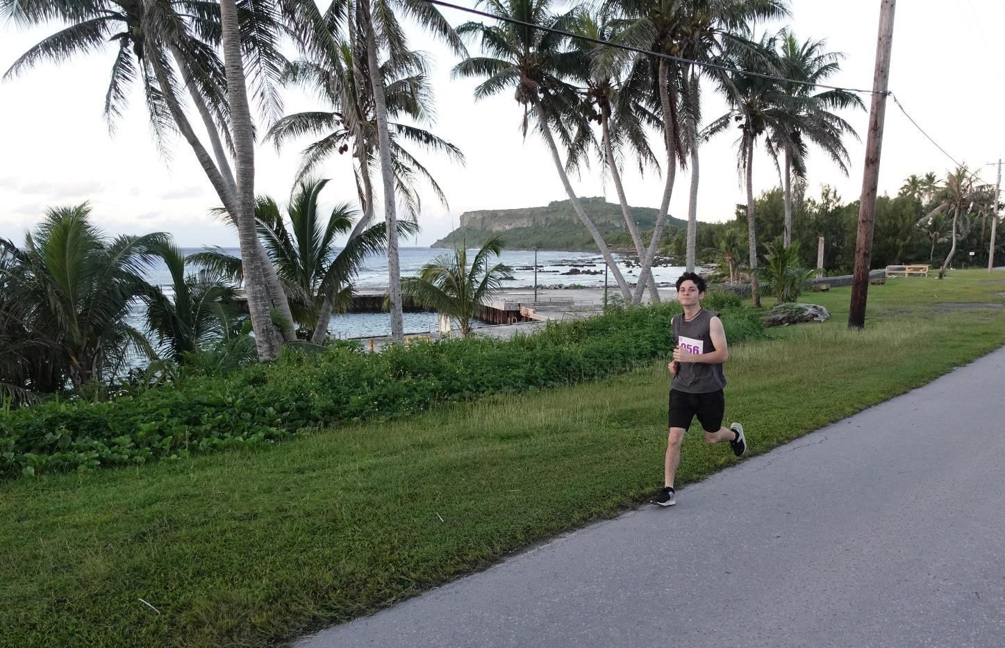 Mark Charfauros takes on the 5K course with Wedding Cake Mountain in the background at Rota Marathon 2024 on Jan. 13, 2024. The marathon was organized by the Marianas Visitors Authority.