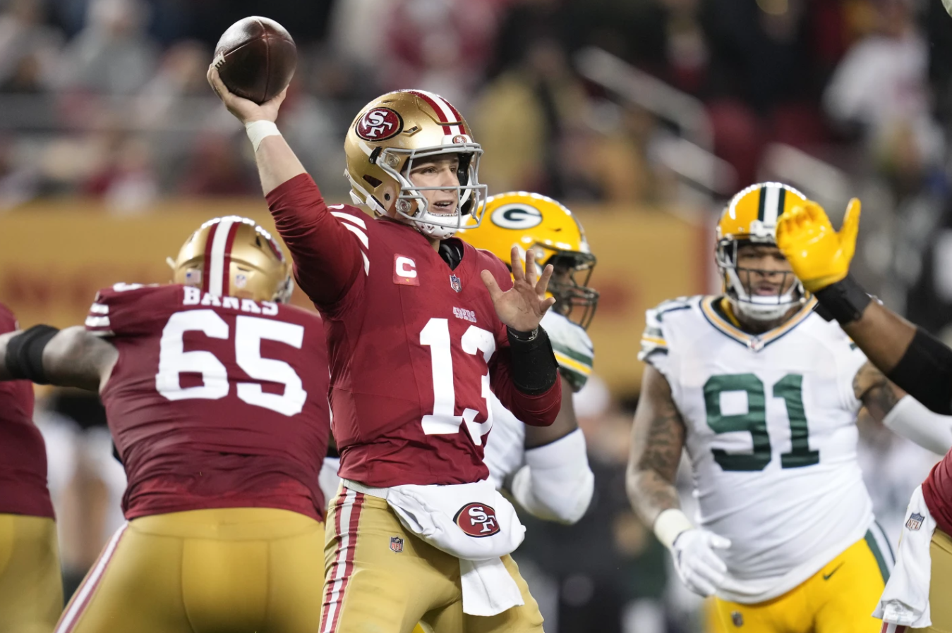 San Francisco 49ers quarterback Brock Purdy (13) throws a pass during the second half of an NFC divisional playoff game against the Green Bay Packers, Saturday, Jan. 20, 2024 in Santa Clara, Calif.