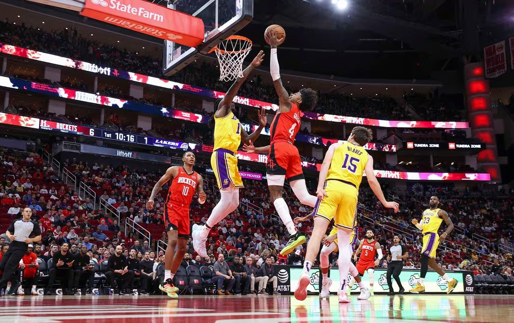 Houston Rockets guard Jalen Green (4) drives to the basket as Los Angeles Lakers forward Taurean Prince (12) defends during the first quarter at Toyota Center in Houston, Texas, Jan 29, 2024.