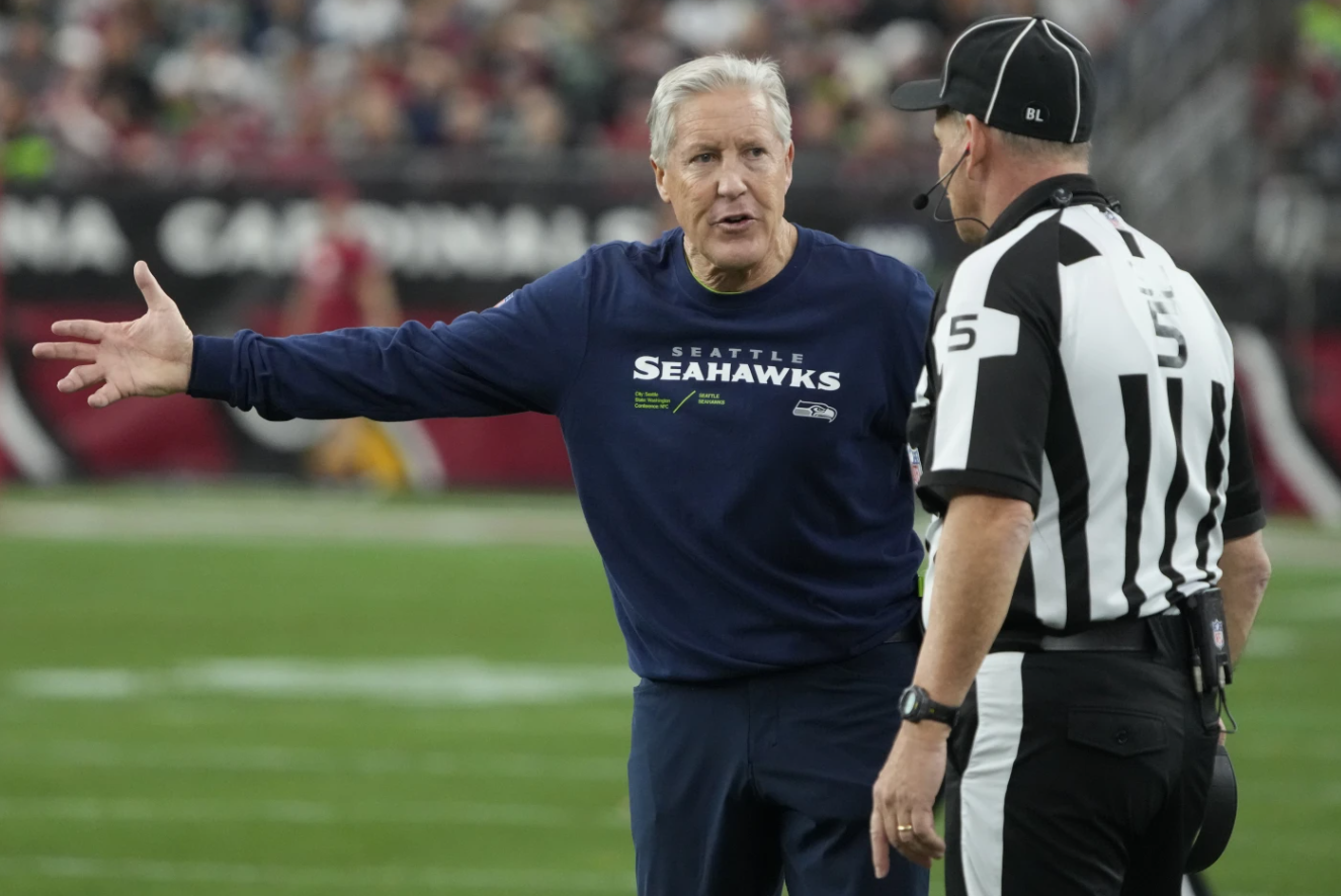 Seattle Seahawks head coach Pete Carroll argues a call with side judge Jim Quirk in the first half of an NFL game against the Arizona Cardinals, Sunday, Jan. 7, 2024 in Glendale, Ariz.