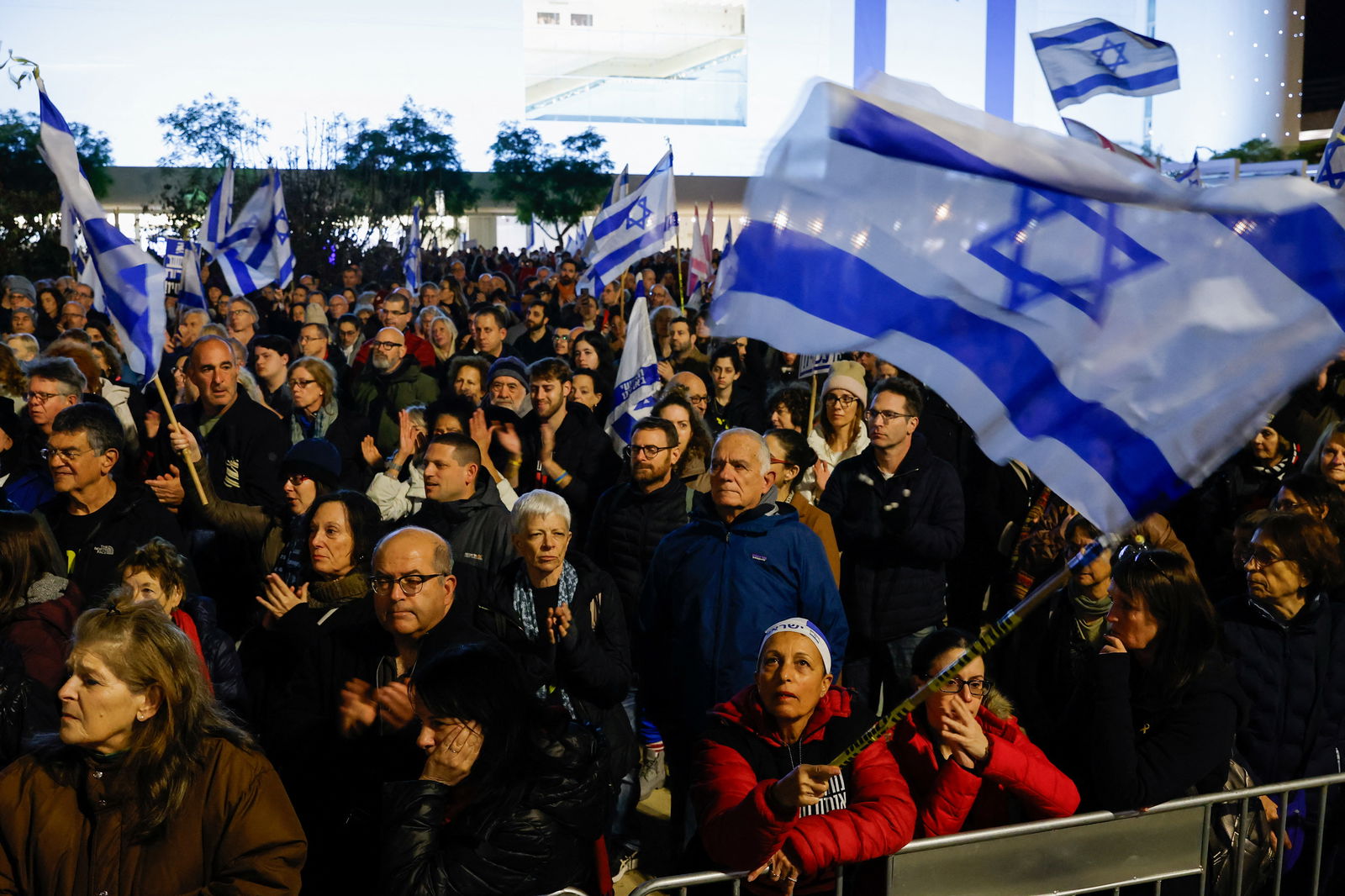 Demonstrators attend a rally demanding an immediate ceasefire in Gaza, amid the ongoing conflict between Israel and the Palestinian Islamist group Hamas, in Tel Aviv, Israel, January 27, 2024. 