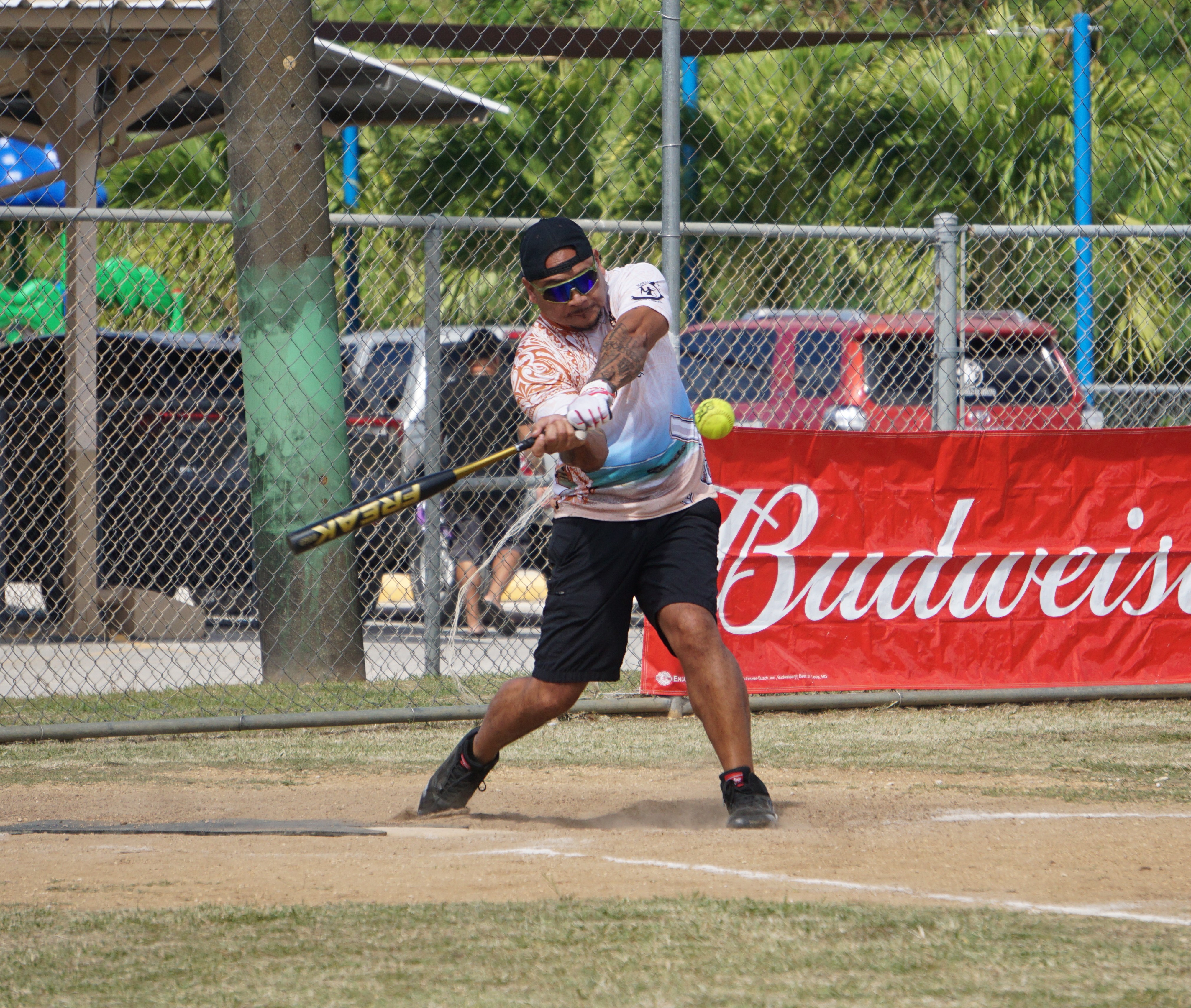 TutuRamz's Eric Cabrera connects a single during a 2024 Budweiser Belau Amateur Softball Association League game at the Dandan baseball field.