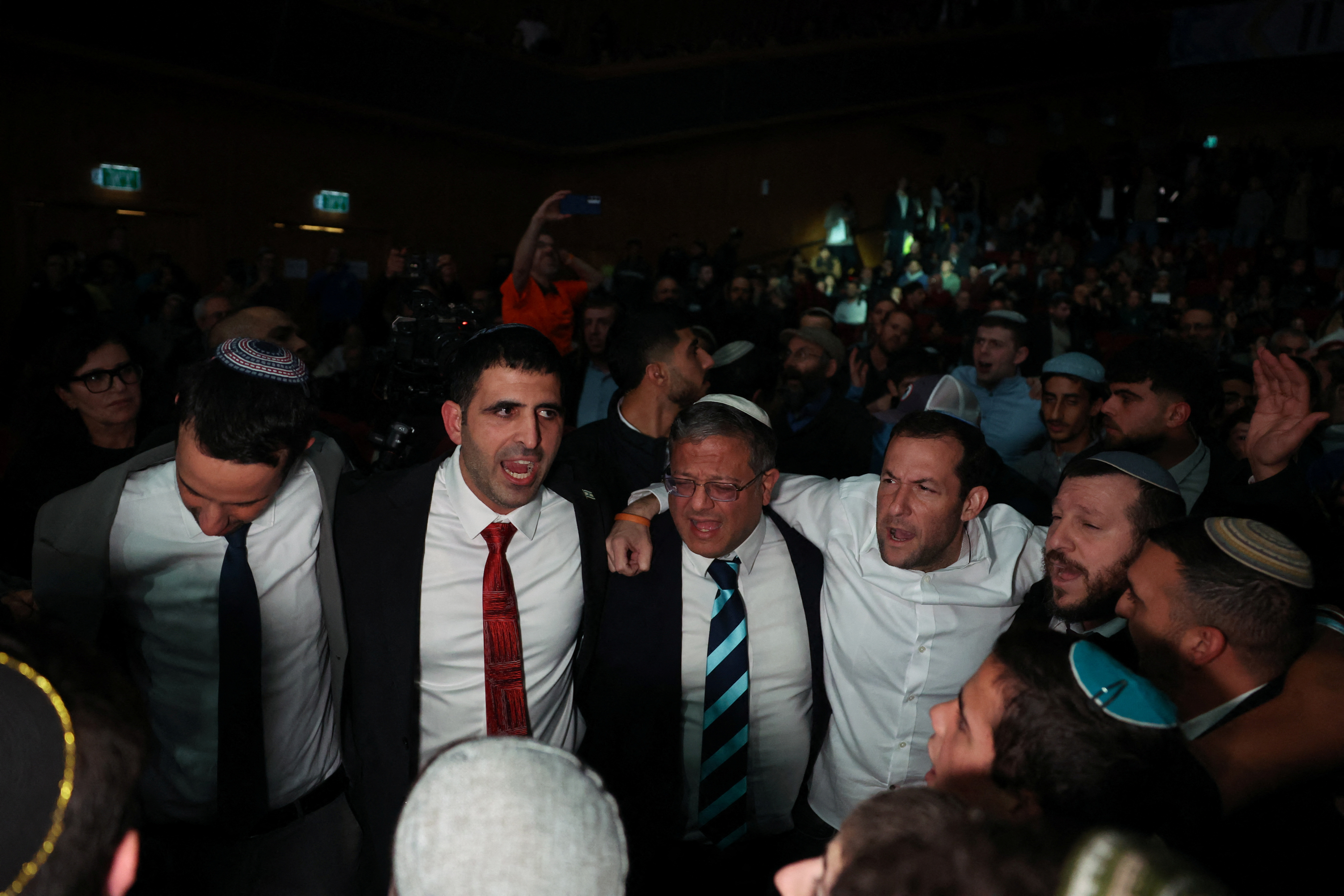 Israel's National Security Minister Itamar Ben-Gvir dances as he attends a convention calling for Israel to rebuild settlements in the Gaza Strip and the northern part of the Israeli-occupied West Bank, in Jerusalem, January 28, 2024. 