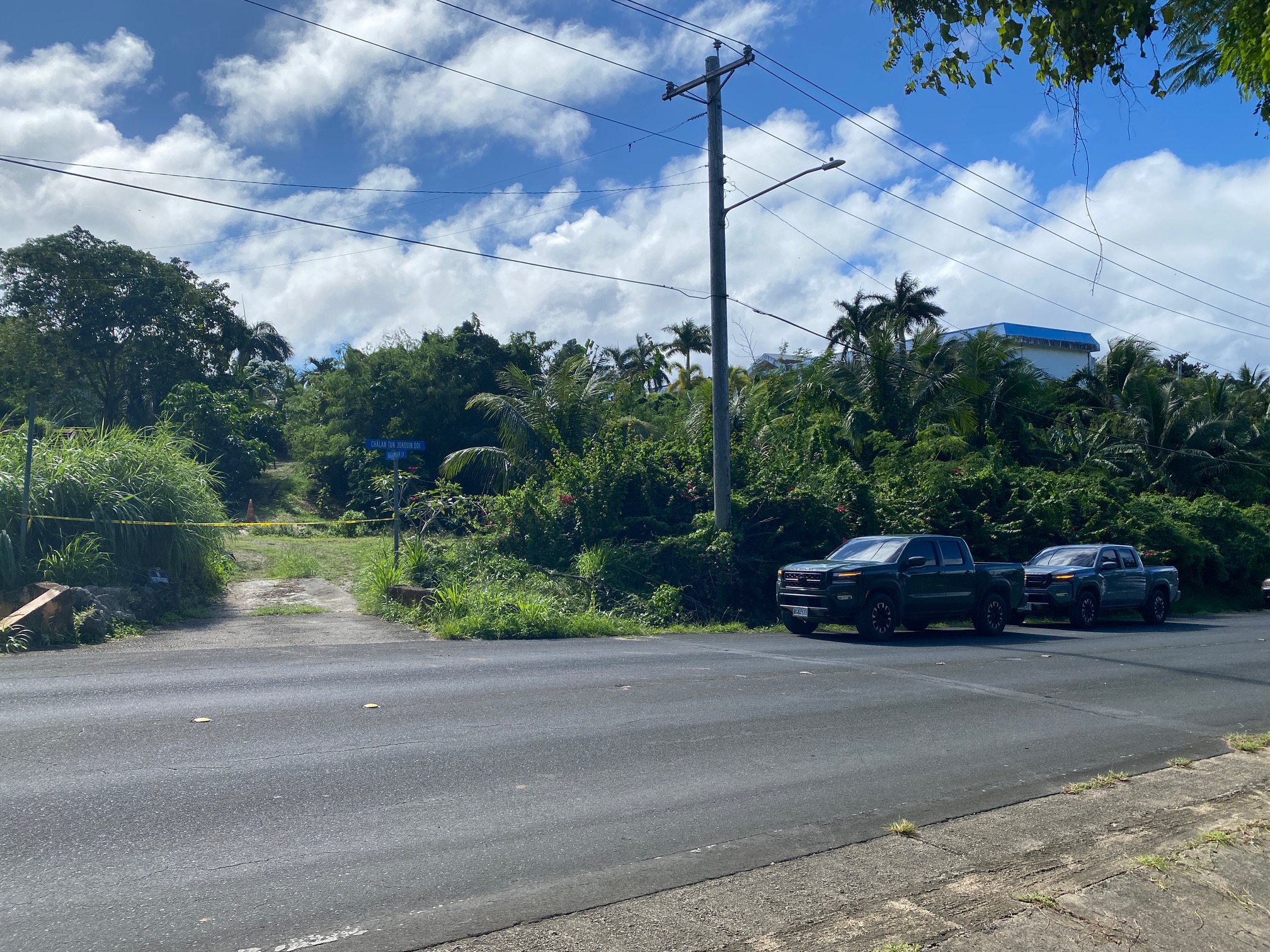 The entrance to Hagamham Lane is blocked by crime scene tape on Thursday, Jan. 4, 2024. Unmarked vehicles are also on site.