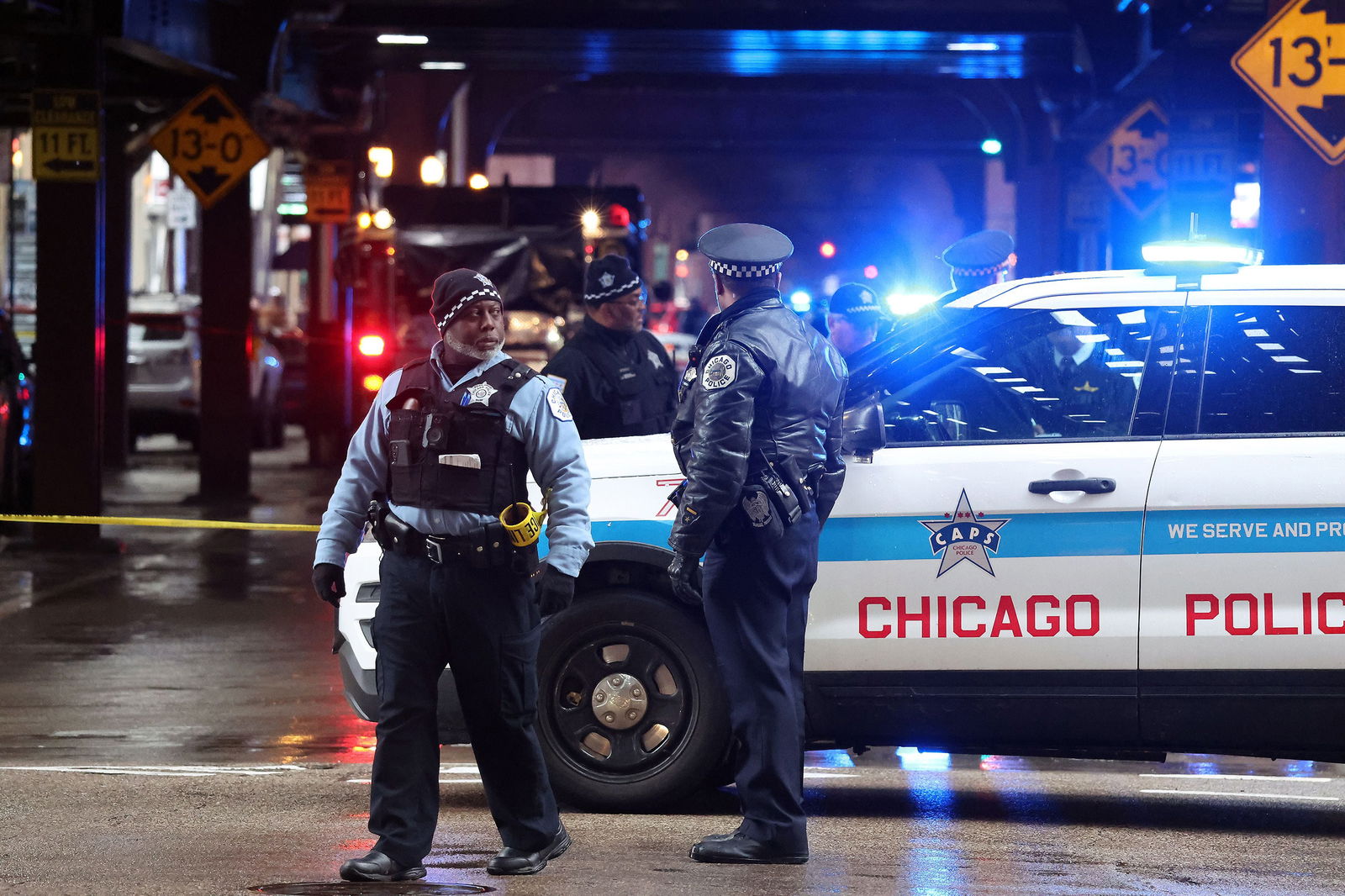 Chicago police conduct an investigation after a shooting on Wabash Avenue between Madison and Washington streets on Friday, Jan. 26, 2024, in Chicago. 