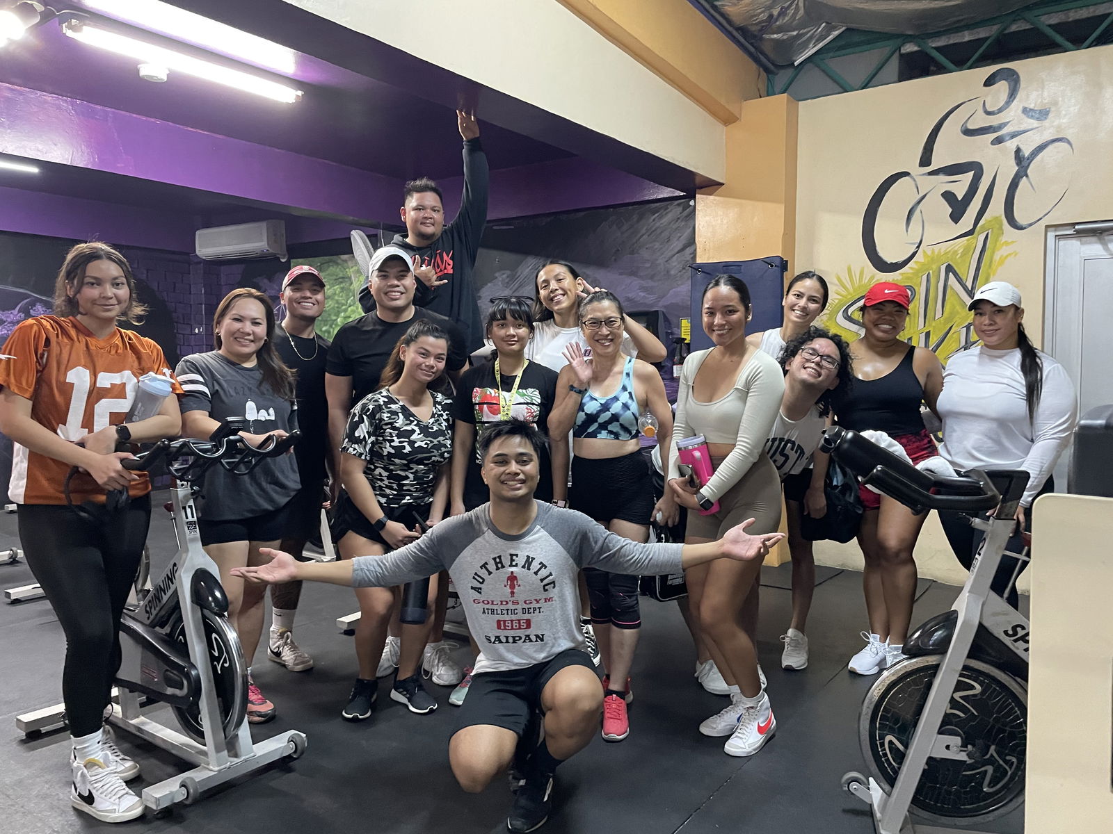 Coach JP poses with his spinning class.