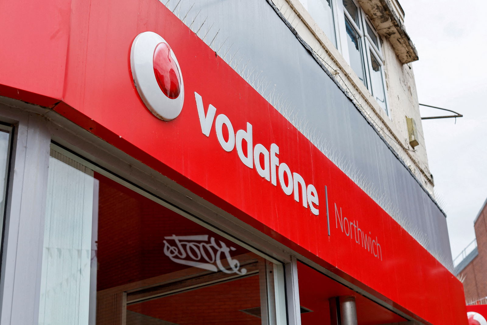 The logo of Vodafone is seen at a Vodafone store in Northwich, Cheshire, Britain, June 7, 2023. 