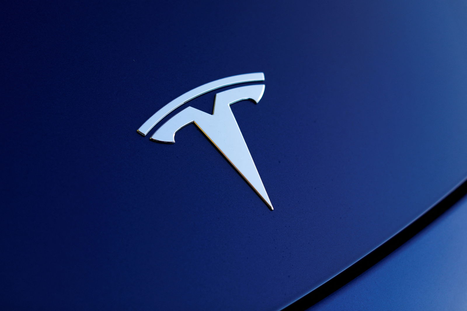 The front hood logo on a 2018 Tesla Model 3 electric vehicle is shown in this photo illustration taken in Cardiff, California, U.S., June 1, 2018. Picture taken June 1, 2018. 