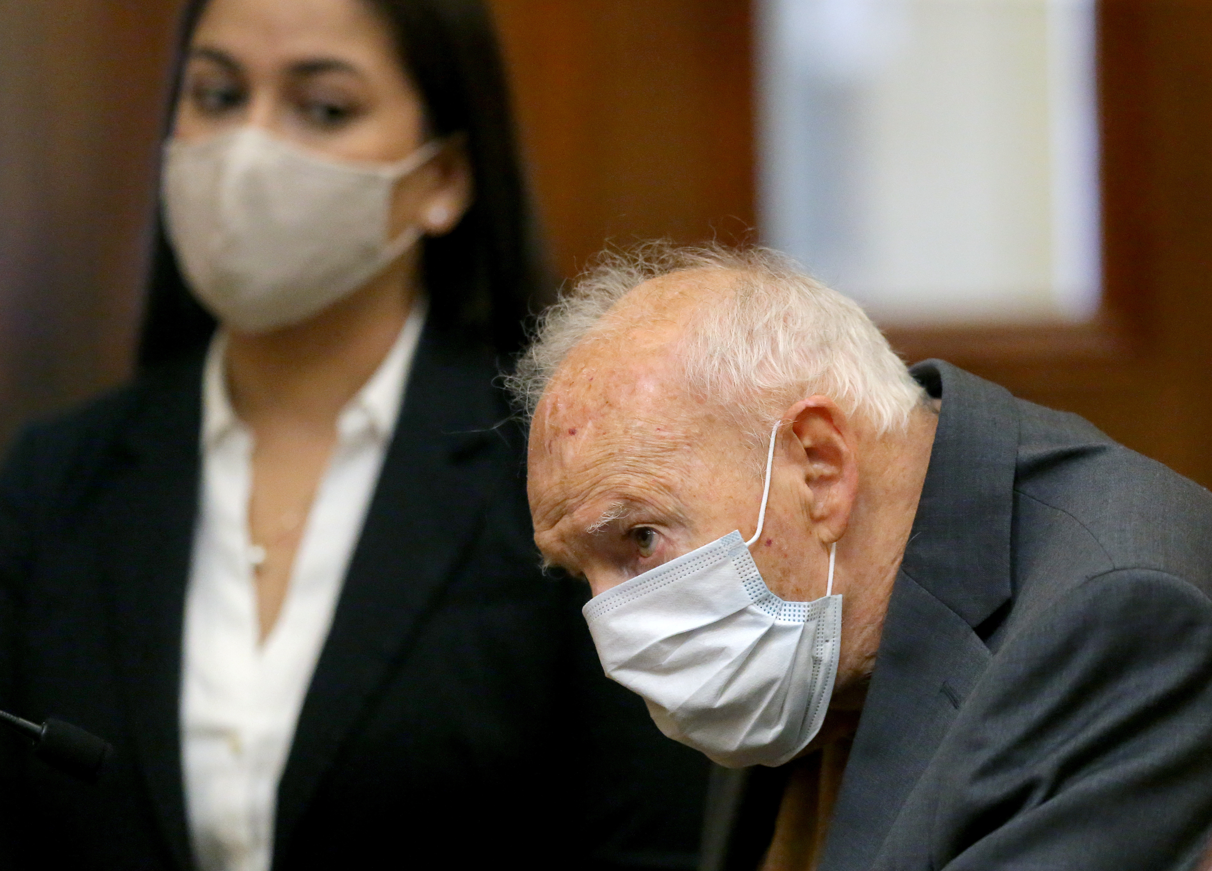 Former Roman Catholic Cardinal Theodore McCarrick wears a mask during arraignment at Dedham District Court, facing charges that he sexually assaulted a 16-year-old boy during a wedding reception at Wellesley College in 1974, in Dedham, Massachusetts, U.S., September 3, 2021. 