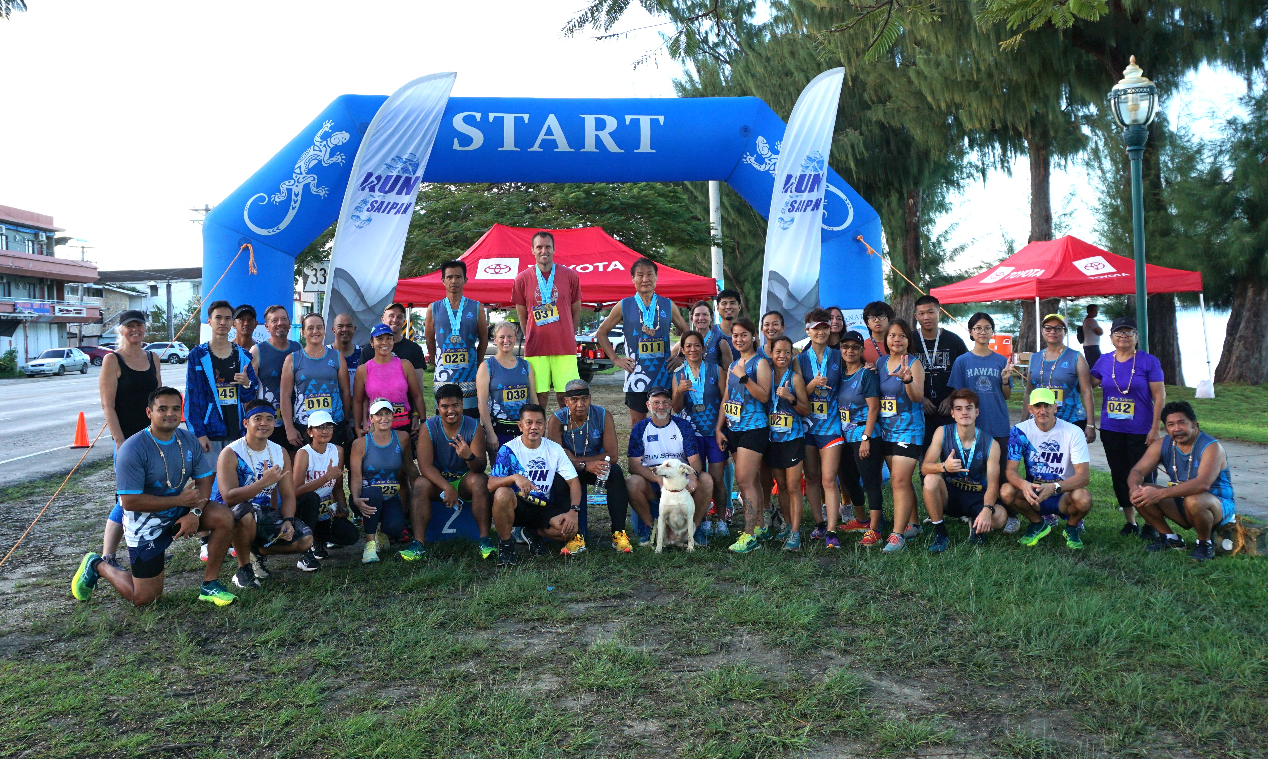 The participants of the inaugural Run Saipan Trinity pose for a photo at the Beach Road pathway in Oleai last year.