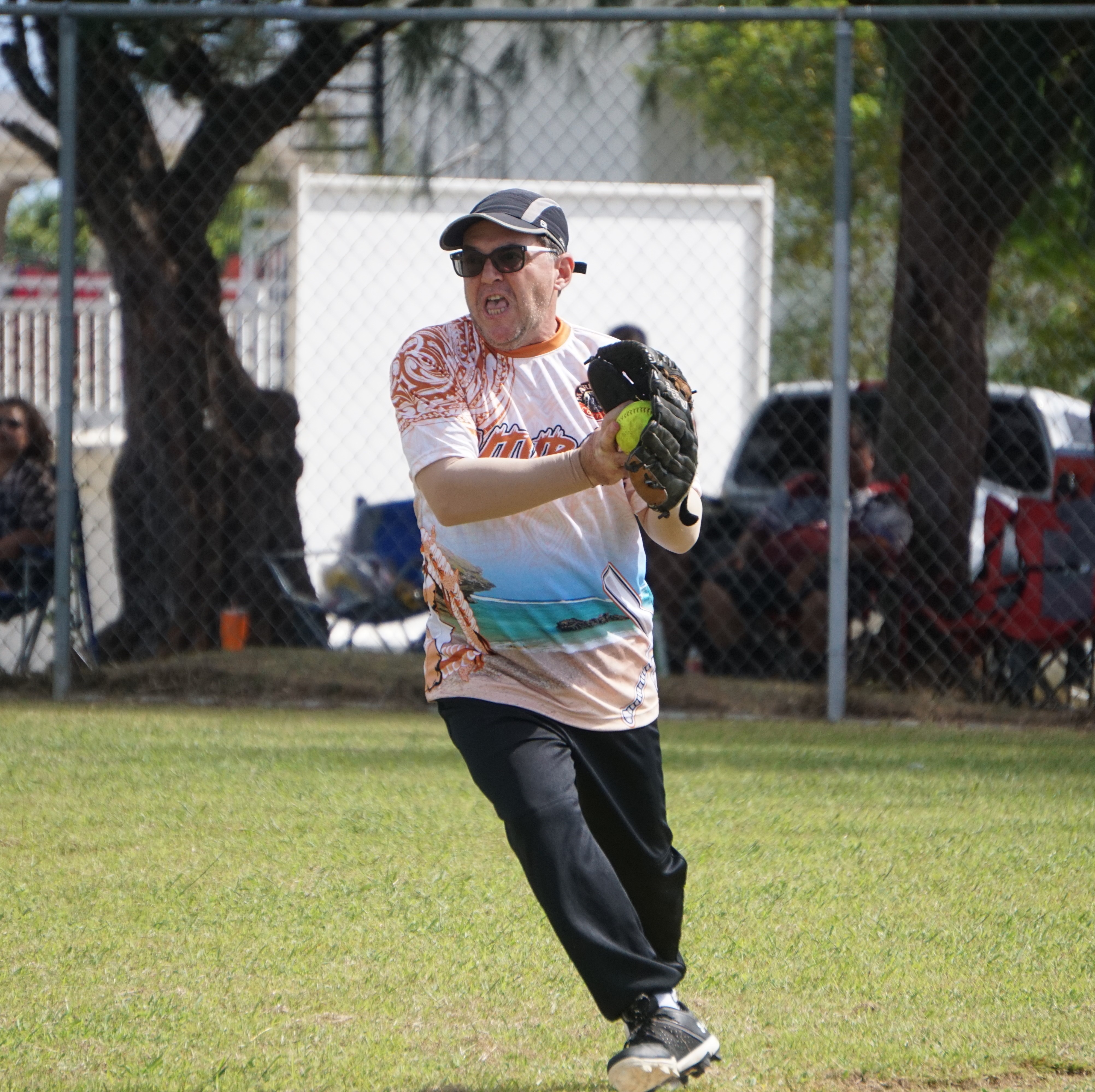 TutuRamz right fielder Jack Cepeda secures the grounder against Tokahao during an opening game of the 2024 Budweiser Belau Amateur Softball Association League at the Dandan baseball field on Sunday.