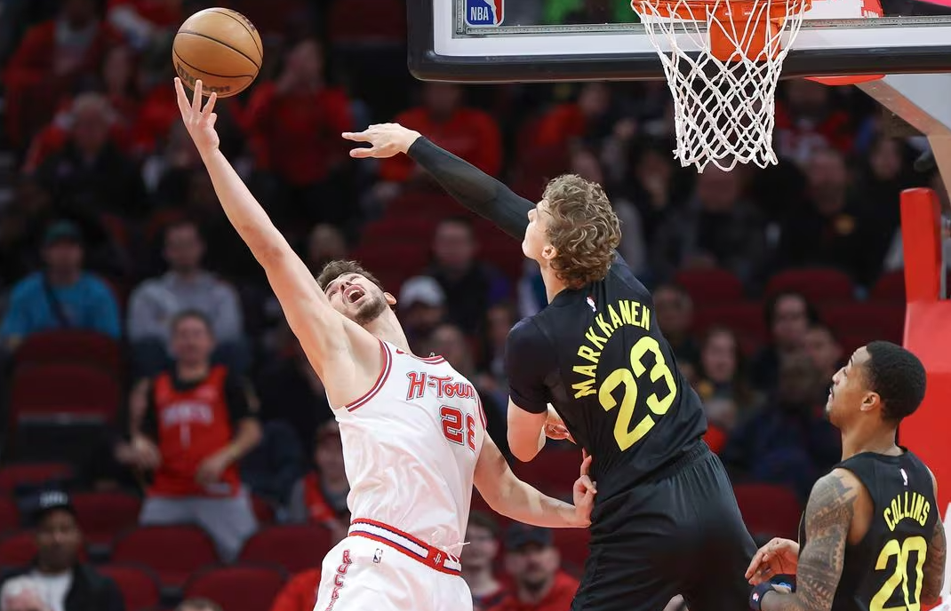 Houston Rockets center Alperen Sengun (28) and Utah Jazz forward Lauri Markkanen (23) attempt to get a rebound during the first quarter at Toyota Center in Houston, Texas, Jan. 20, 2024.