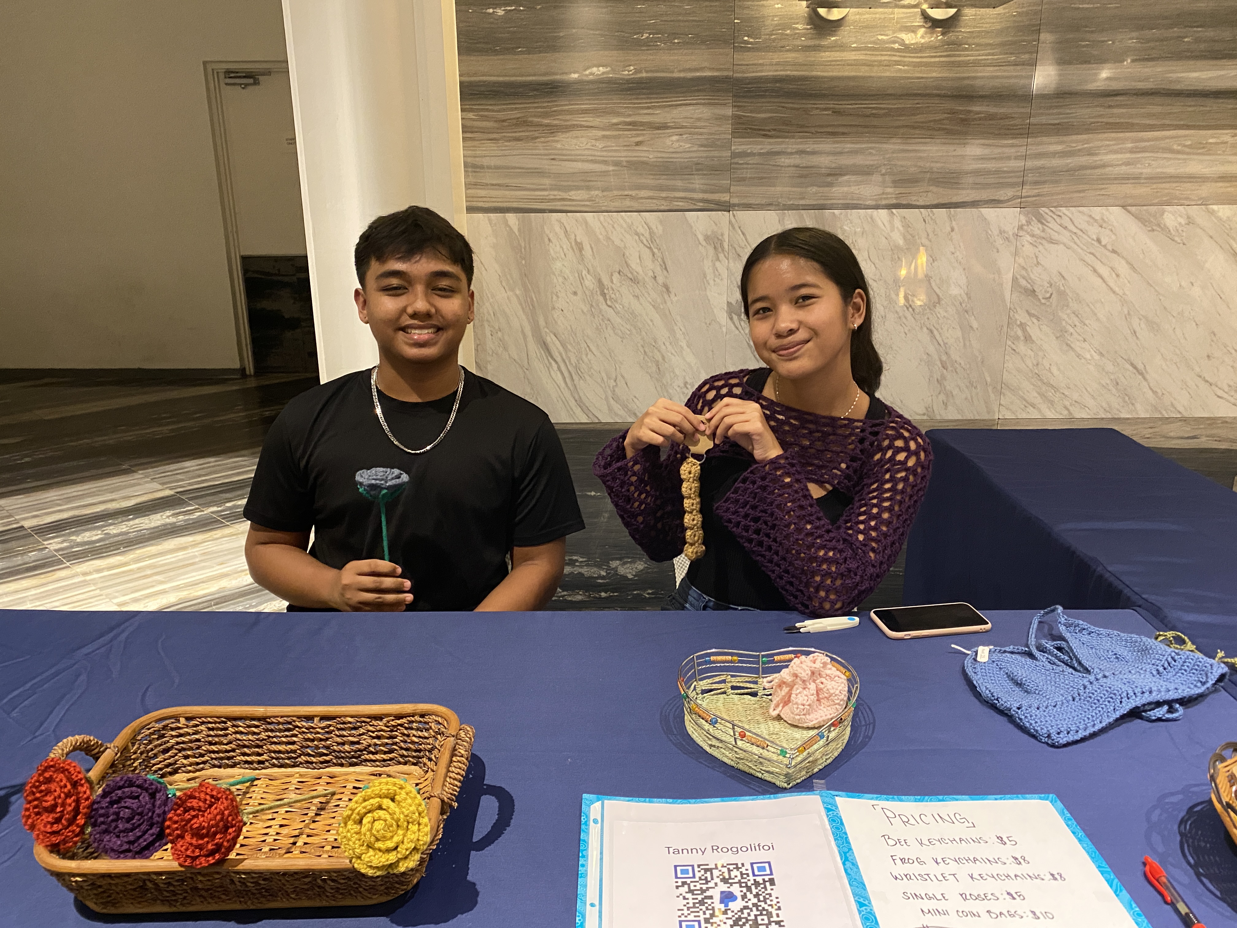 Tanny Rogolofoi, right, is the proprietor of Tanny's Crafts, which offers crotched tops, flowers, and key chains.