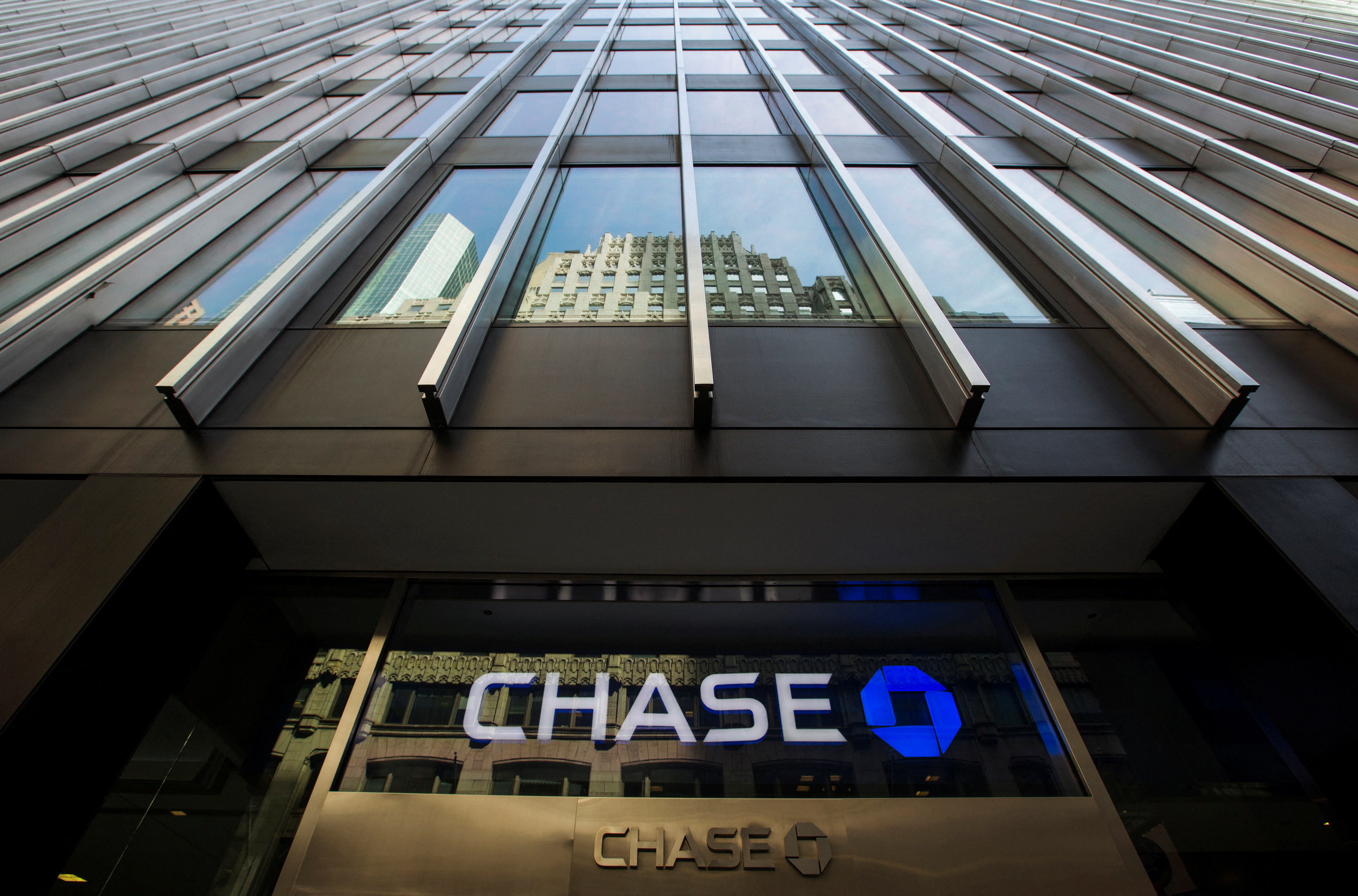 A sign is mounted on the side of a branch of the JPMorgan Chase & Co bank in New York, March 15, 2013. 