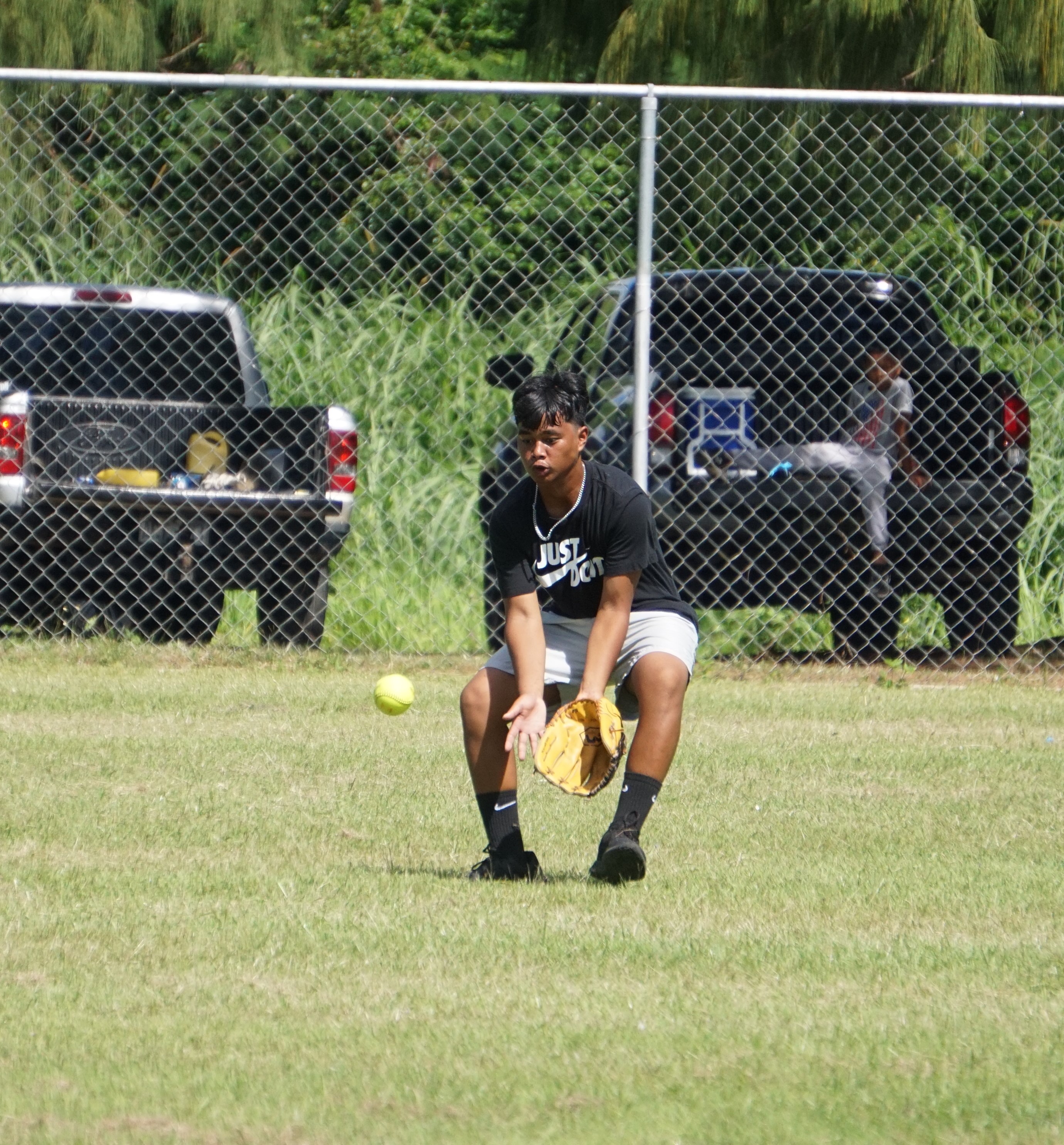 Dandan Middle School left center fielder Matthew Serphim secures the grounder during a boys middle school division game of the SBL-PSS Interscholastic Softball League SY23-24 held at the Dandan baseball field on Saturday.