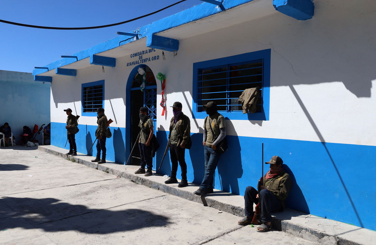 Members of the community police wait before a ceremony for children to join the ranks of the self-defense group, few days after an armed group abducted four people from the community, in Ayahualtempa, Guerrero state, Mexico, January 24, 2024. 