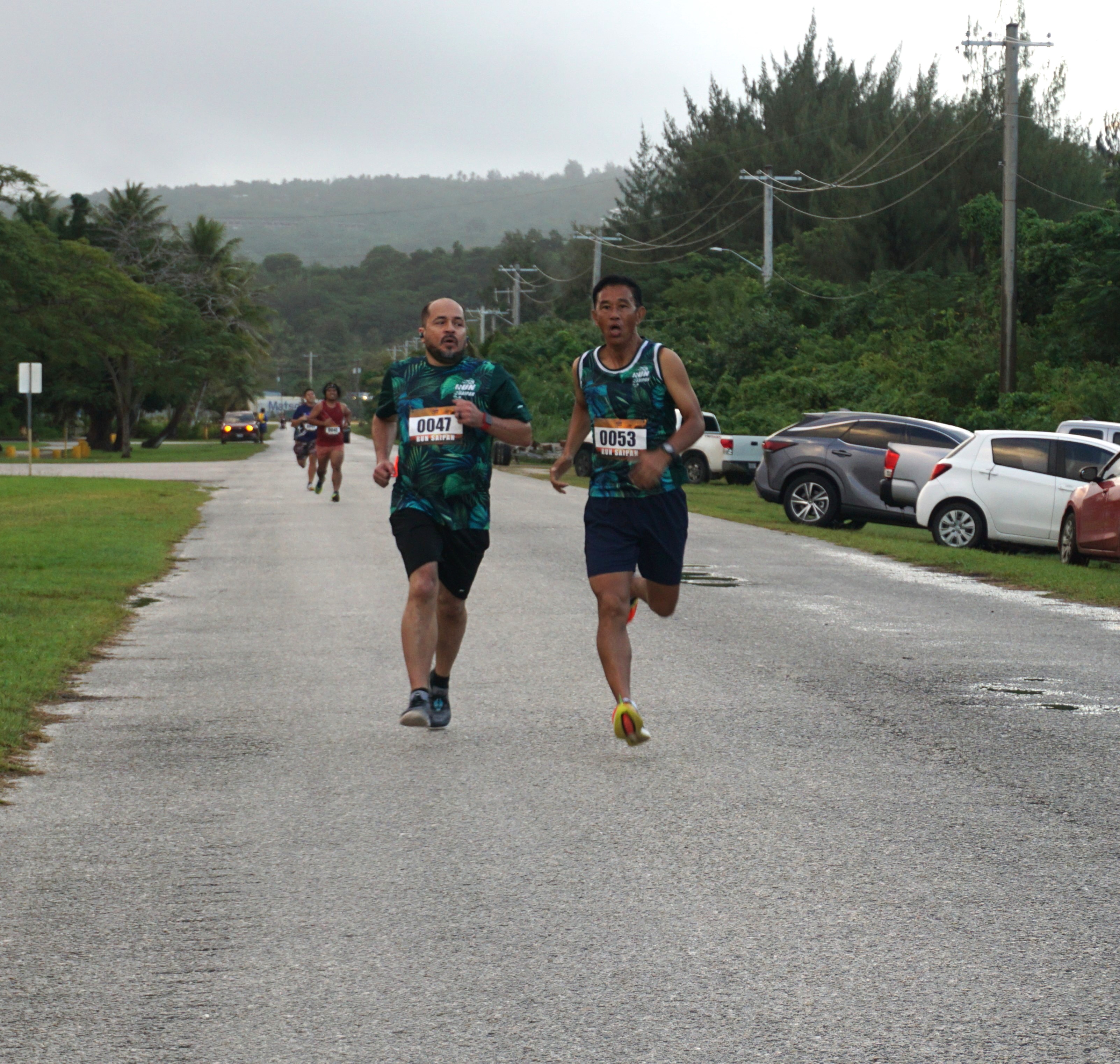 Galvin “Dr. G” Deleon Guerrero and James Abuy head for the finish line of the mile-long Run from 2023 race hosted by Run Saipan on Sunday at Smiling Cove Marina.