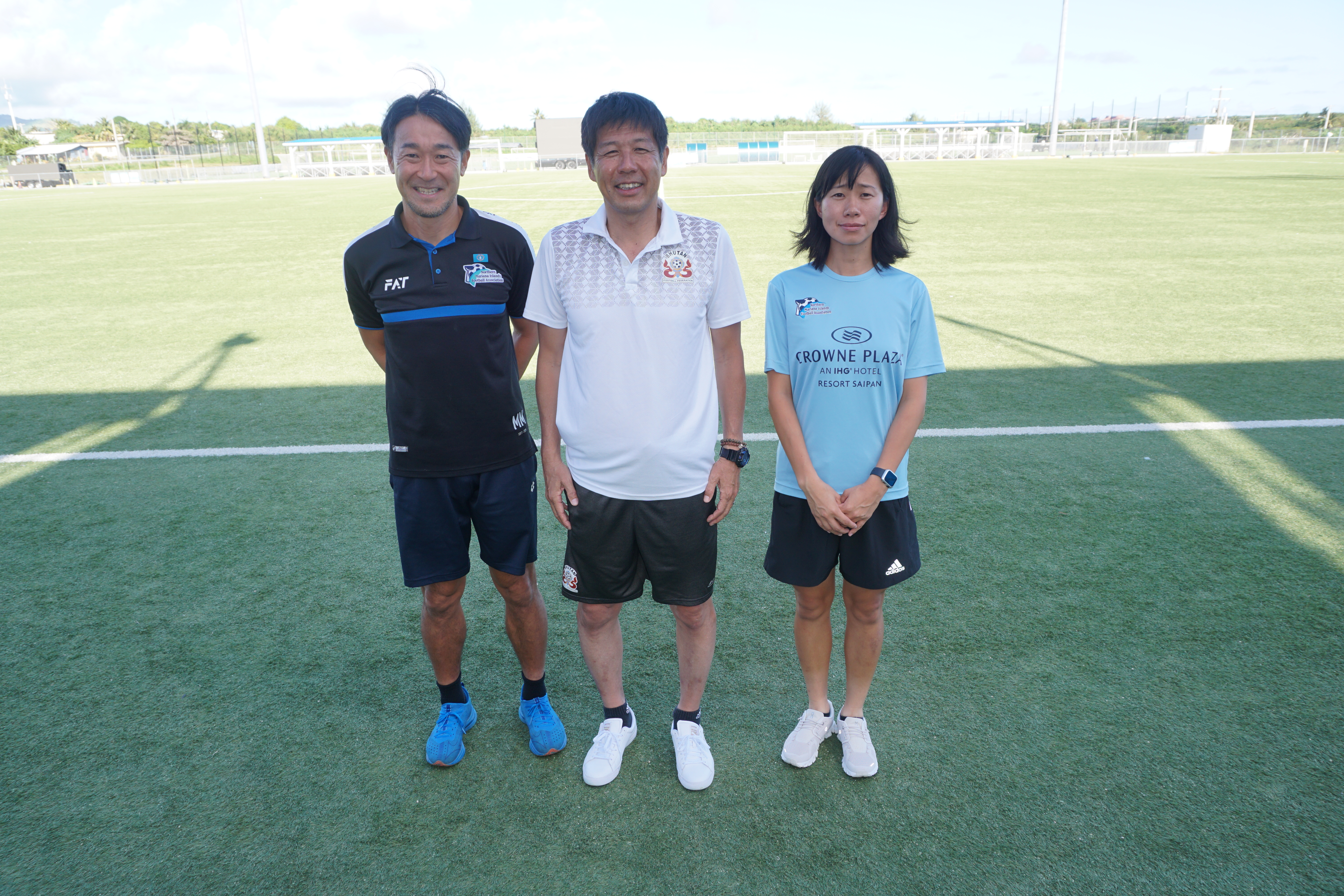 Visiting Coach Hide Takashi, center, poses with NMI Football Association officials at the NMI Soccer Training Center in Koblerville. 