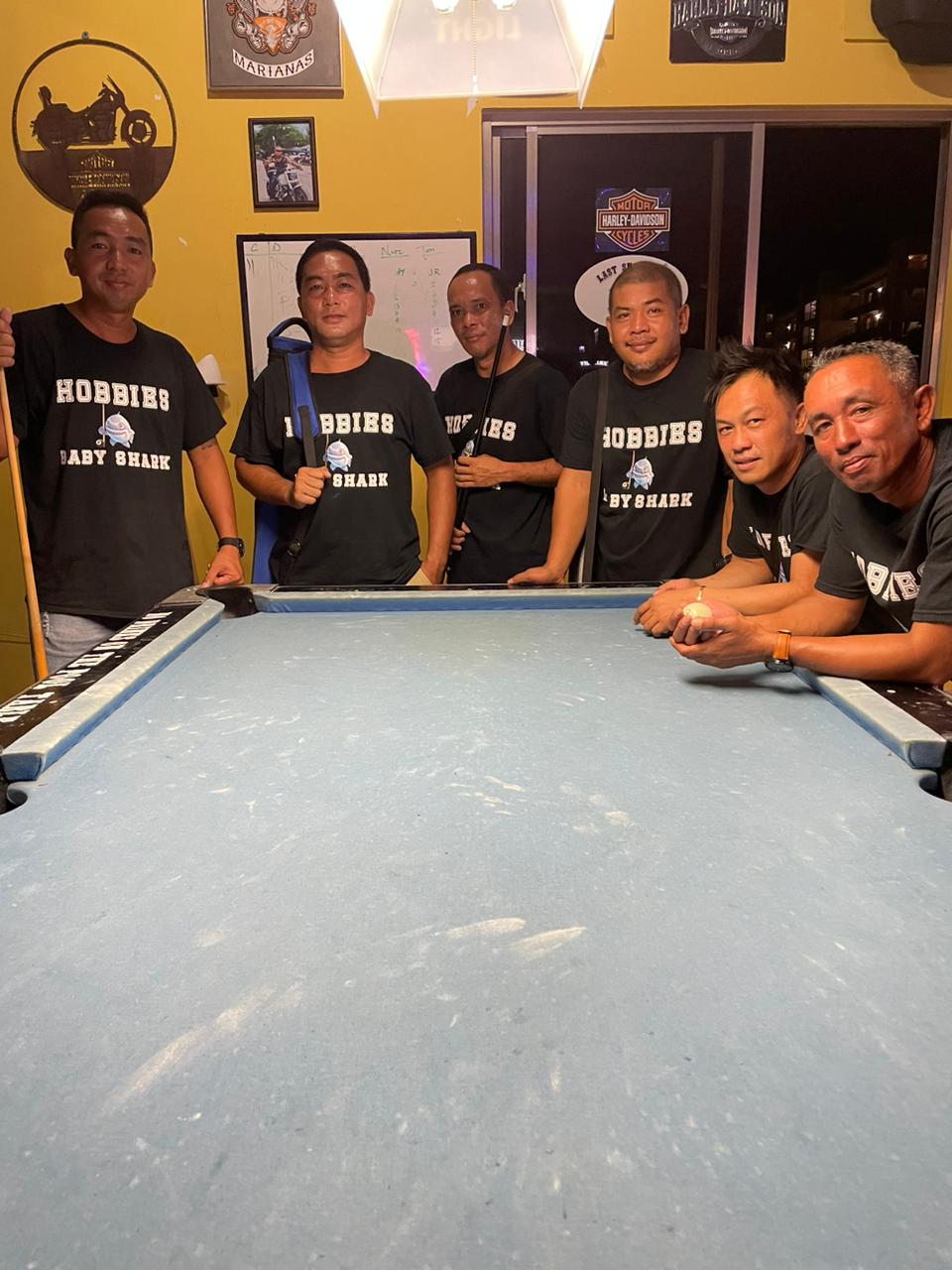 The True North Hobbies pose after playing a game in the Thursday Division of the 2023 Budweiser Open 8-Ball League at the Black 8 Pool Bar.