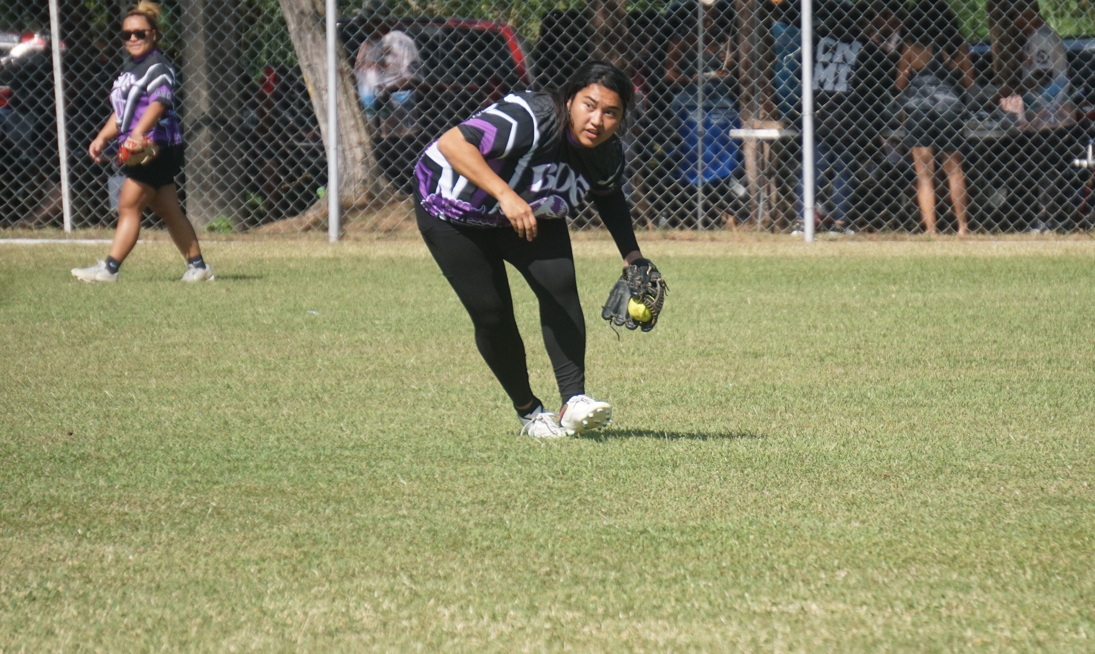 BDE left centerfielder Maribel Igitol secures the line drive during a ladies division game of the 2024 Budweiser Belau Amateur Softball Association League at the Dandan baseball field on Sunday.