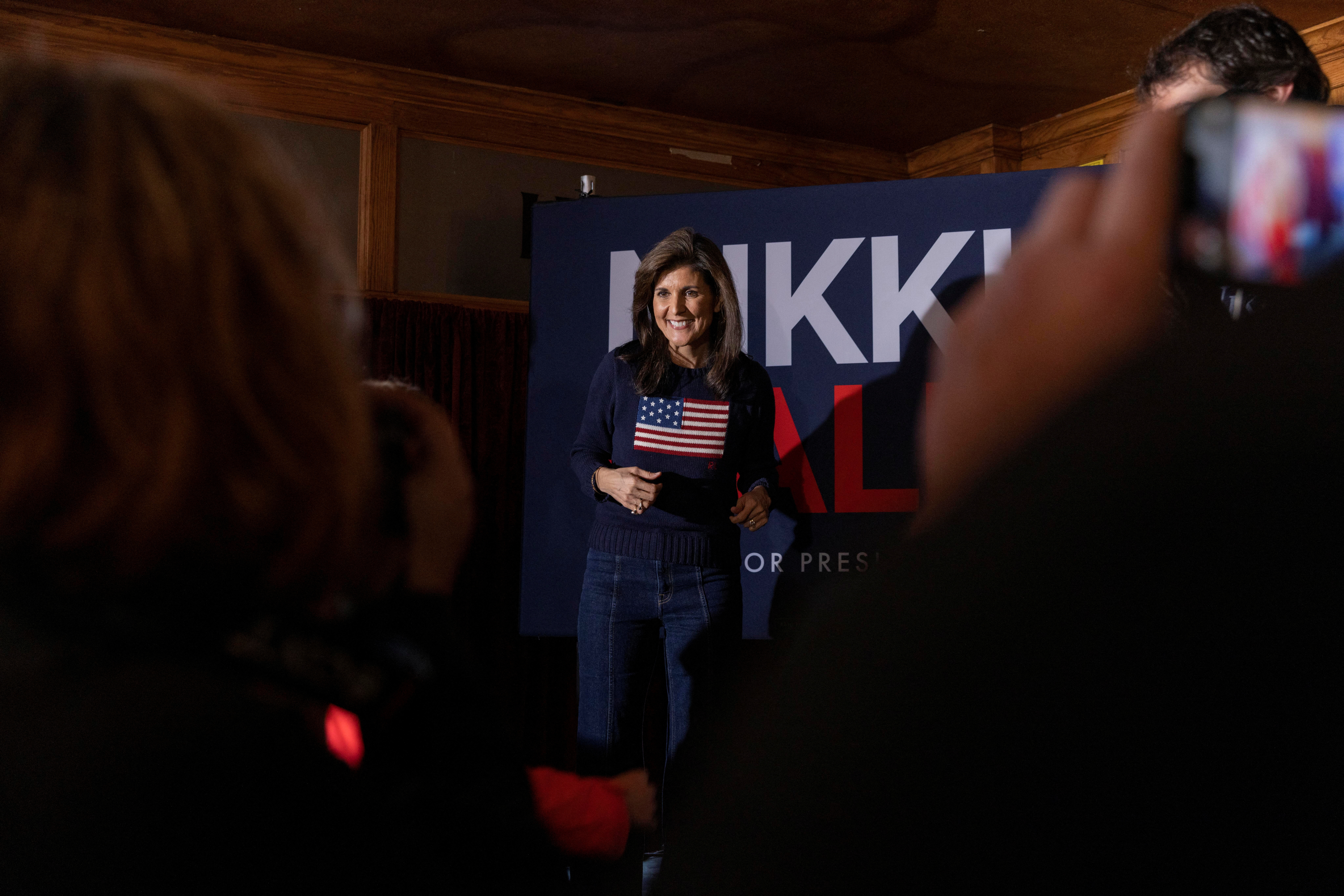 Republican presidential candidate and former U.S. Ambassador to the United Nations Nikki Haley greets people during a campaign stop at Mickey's Irish Pub ahead of the Iowa caucus vote in Waukee, Iowa, U.S., January 9, 2024. 