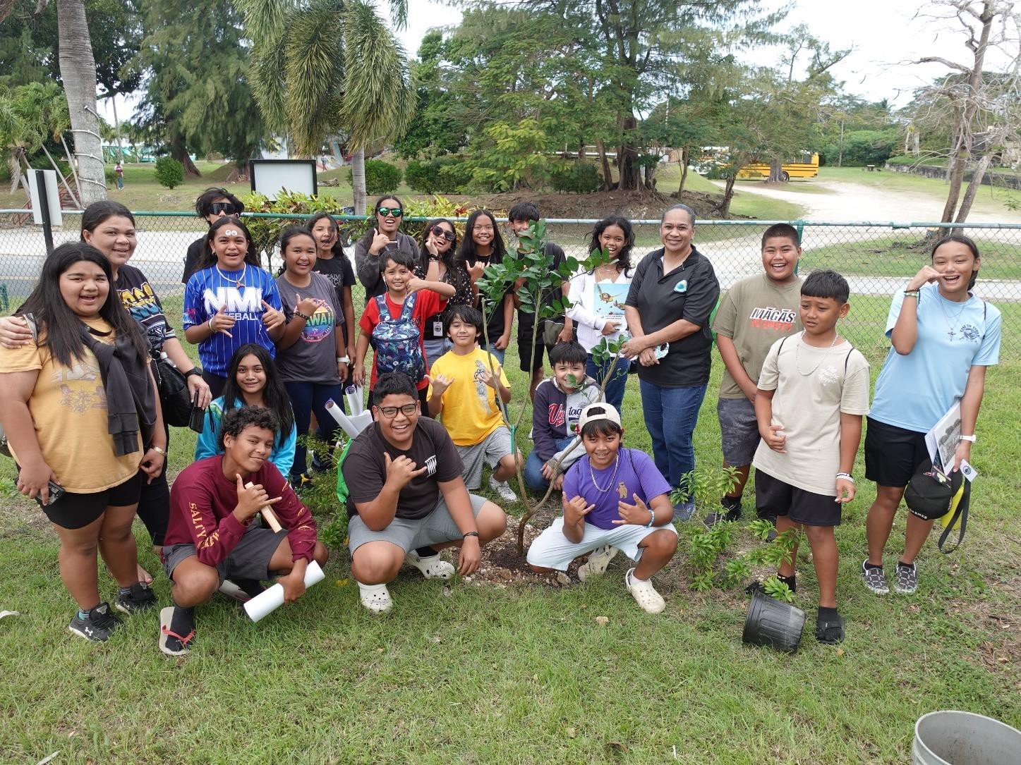MY WAVE Club students and chaperones of Tanapag Middle School plant a tree at Sugar King Park during the Marianas Tourism Education Council on Jan. 19, 2024. In all, clubs planted 10 trees at Garapan Central Park and Sugar King Park.
