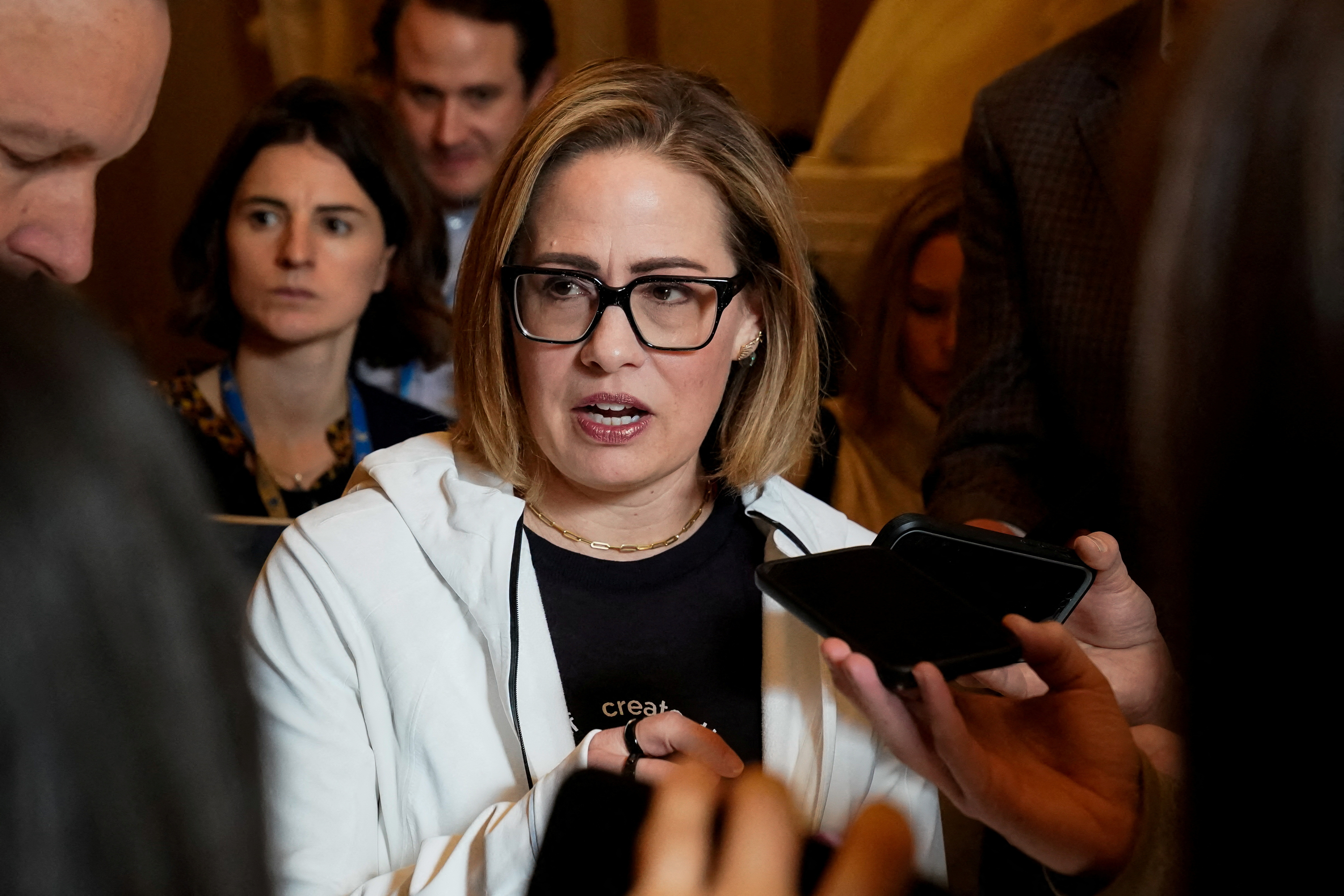 U.S. Senator Kyrsten Sinema speaks to reporters about ongoing negotiations on a U.S. border security deal at the U.S. Capitol in Washington, U.S., December 20, 2023. 