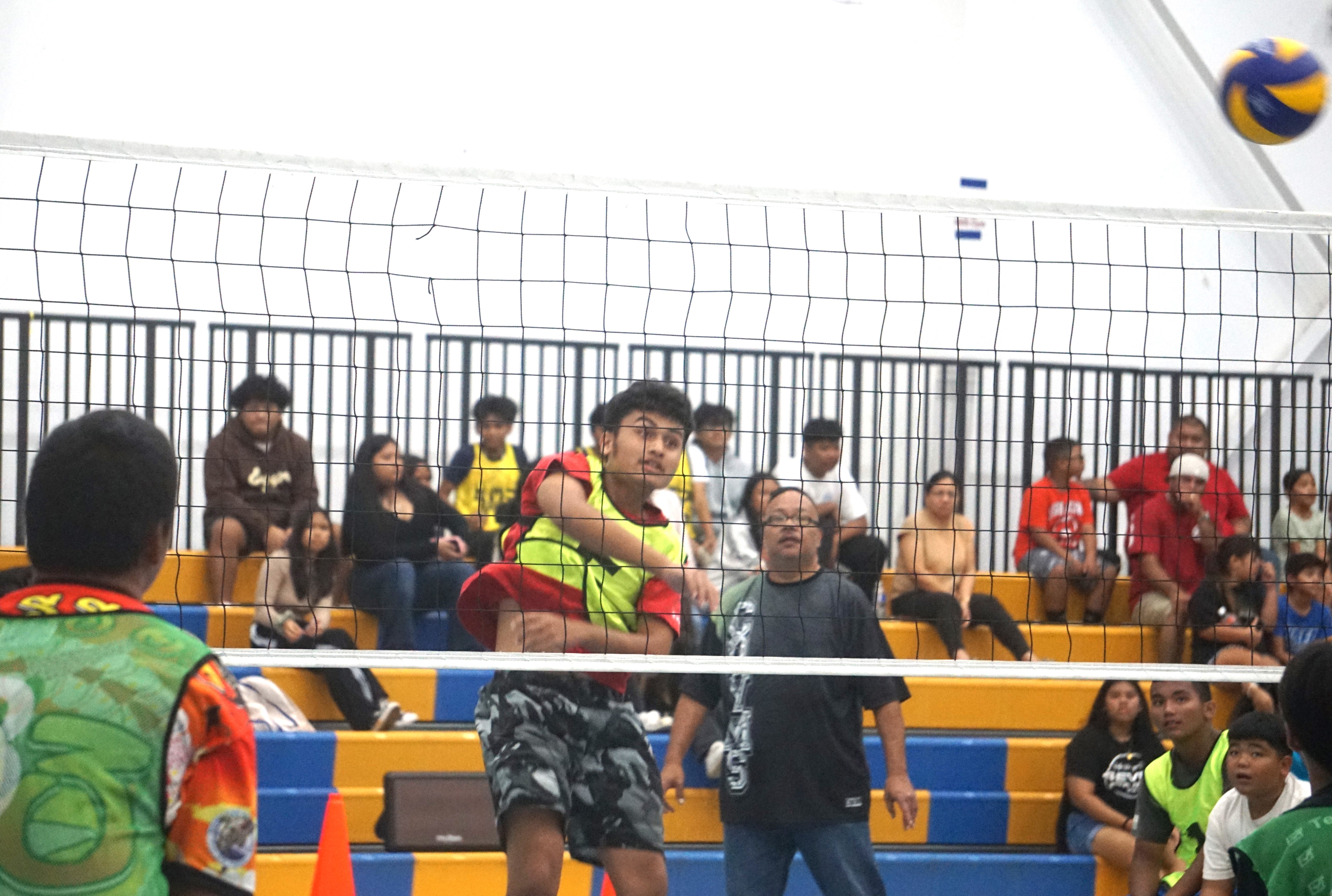 Chacha’s Ethan Dikito connects a spike during a boys middle school division game of the NMIVA-PSS Interscholastic Volleyball League SY23-24 at the Marianas High School gym on Thursday.