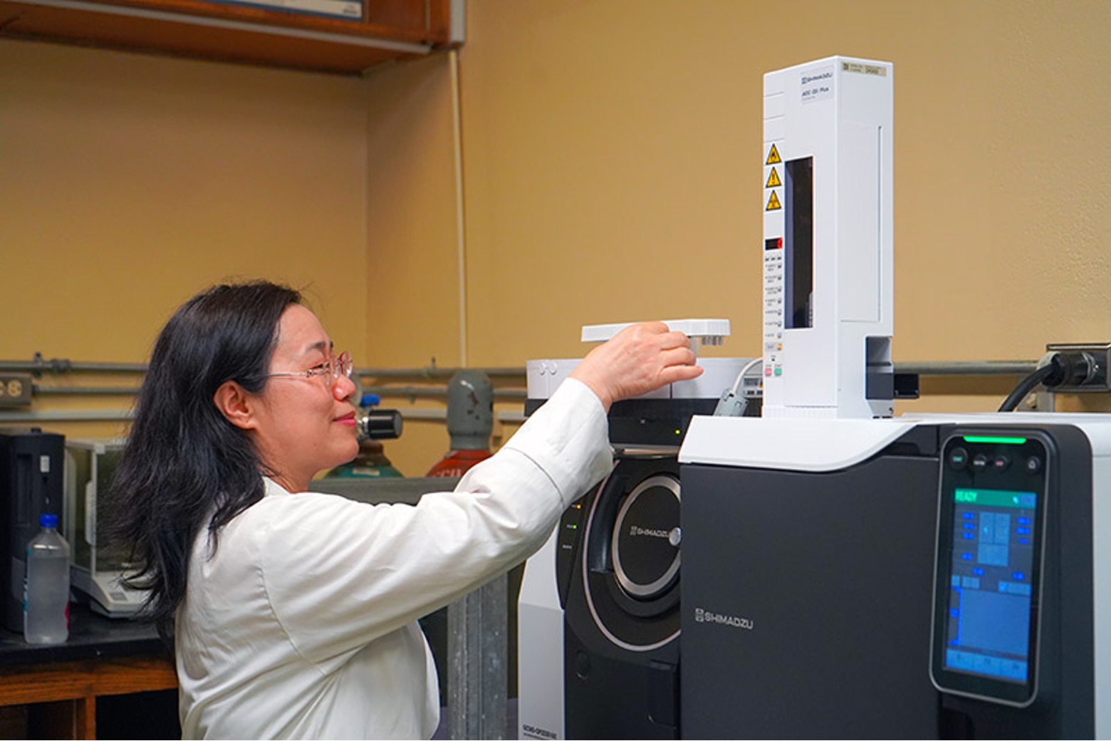 Associate Professor of Chemistry Dr. Bulan Wu inputs a substance into a gas chromatograph mass spectrometer for separation and identification of its chemical elements. The instrument is a new addition to UOG’s chemistry instrumentation lab.