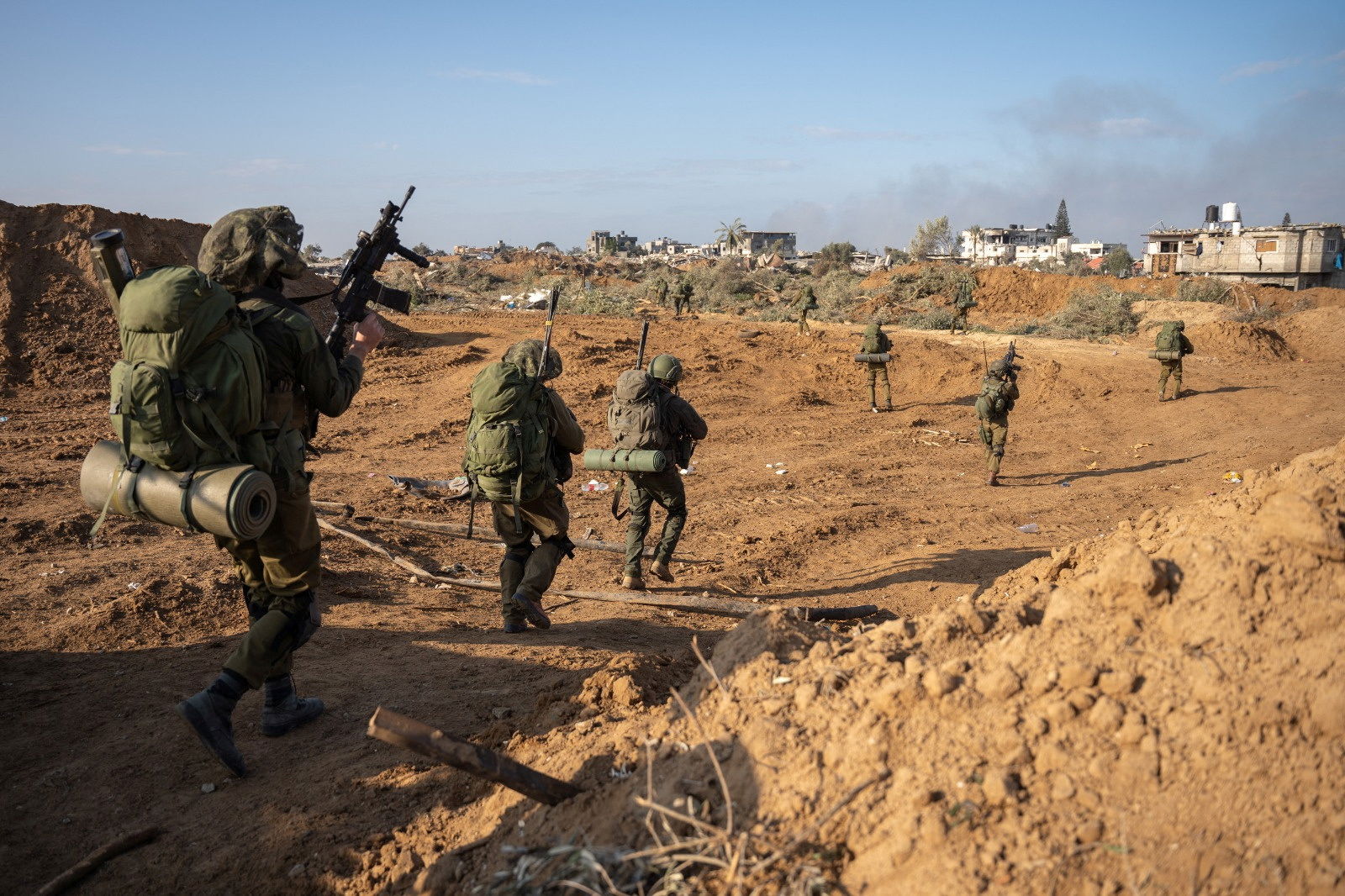 Israeli soldiers take part in a ground operation, amid the ongoing conflict between Israel and the Palestinian Islamist group Hamas, in a location given as Gaza Strip, in this handout picture released on January 19, 2024. 