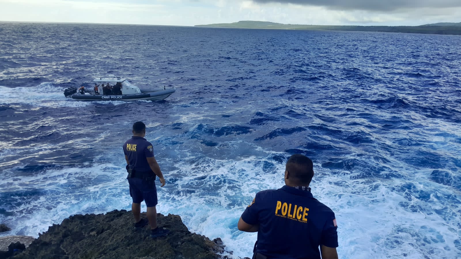 Department of Public Safety officers search for the drowning victim in the waters off Hidden Beach on Wednesday.