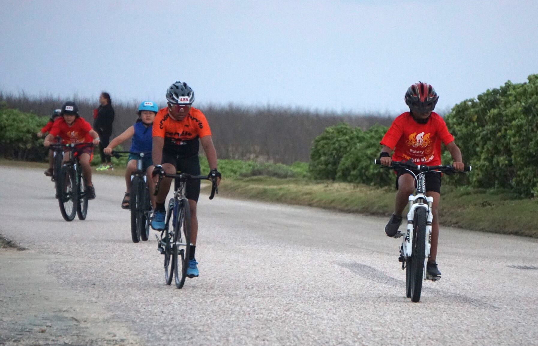Young bikers make their way to the finish line of the 2024 Rotary Club of Saipan "End Polio Now" Cycling Challenge at Banzai Cliff on Saturday.