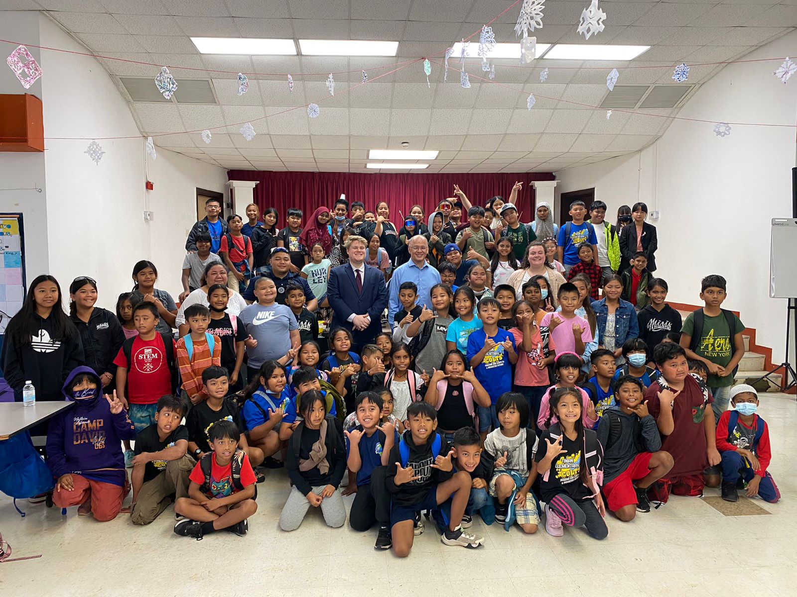 Justice John A. Manglona, Marshal Bradley Lizama and law clerks Paige Lehman and Patrick Quimby join the students and teachers at Tinian Elementary School.