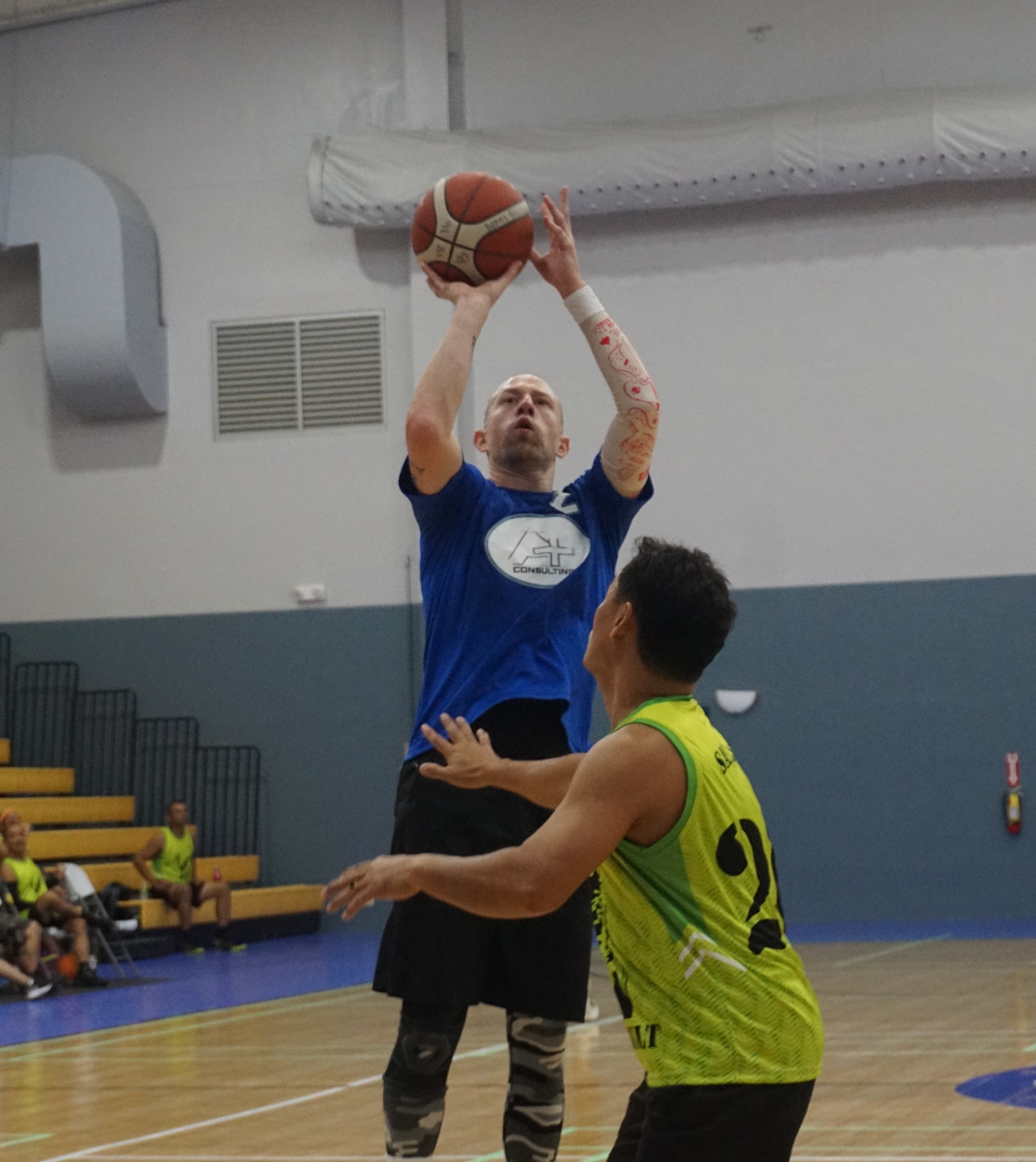 A Plus' Chris Sanchez pulls up for the midrange jumper over a defender during a Masters "Internal" Basketball League game at the Ada gym on Saturday.