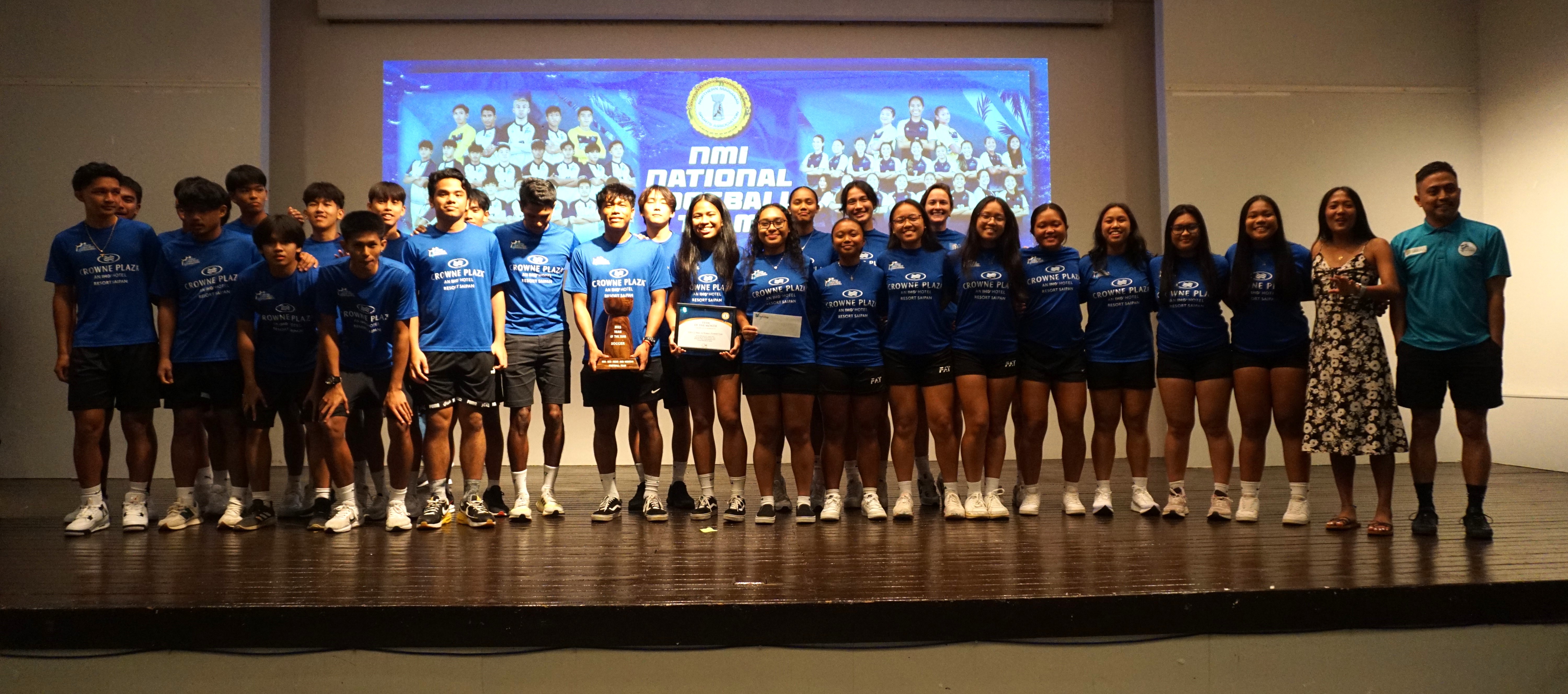 The members of the NMI U23 Men's and Women's National Soccer Teams pose for a photo after receiving the Team of the Year trophy during the 2023 Northern Marianas Sports Association Annual Awards Banquet at the Hibiscus Hall of Crowne Plaza Resort Saipan on Wednesday.