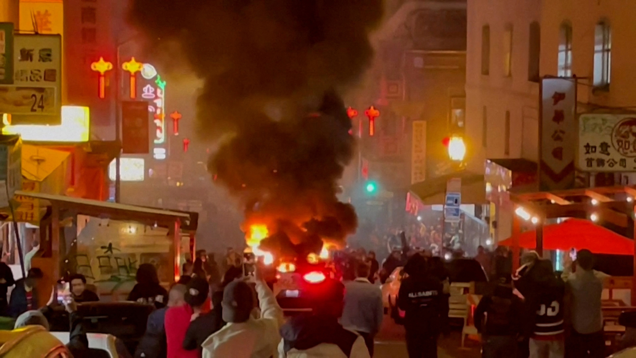 A Waymo self-driving robotaxi, owned by Alphabet's autonomous driving unit, is engulfed in flames after the San Francisco Fire Department said in a statement on social media that fireworks were thrown inside the vehicle, in San Francisco, California February 10, 2024 in a still image from video. 