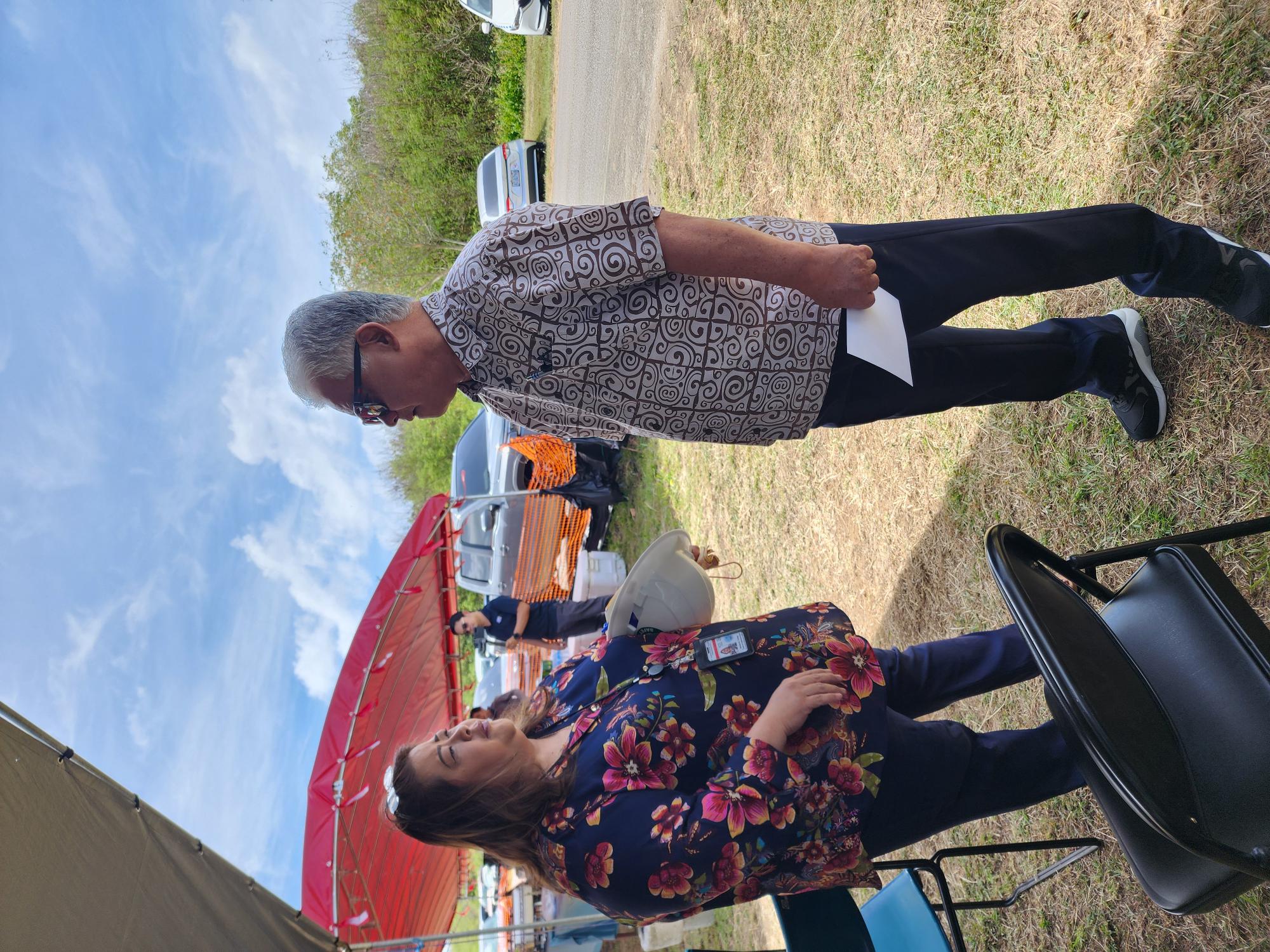 Commonwealth Utilities Corp. Acting Executive Director Betty Terlaje talks with Gov. Arnold I. Palacios prior to the groundbreaking ceremony for the Isley Field and Obyan Wells Granular Activated Carbon Water Filtration System Construction Project on Friday.
