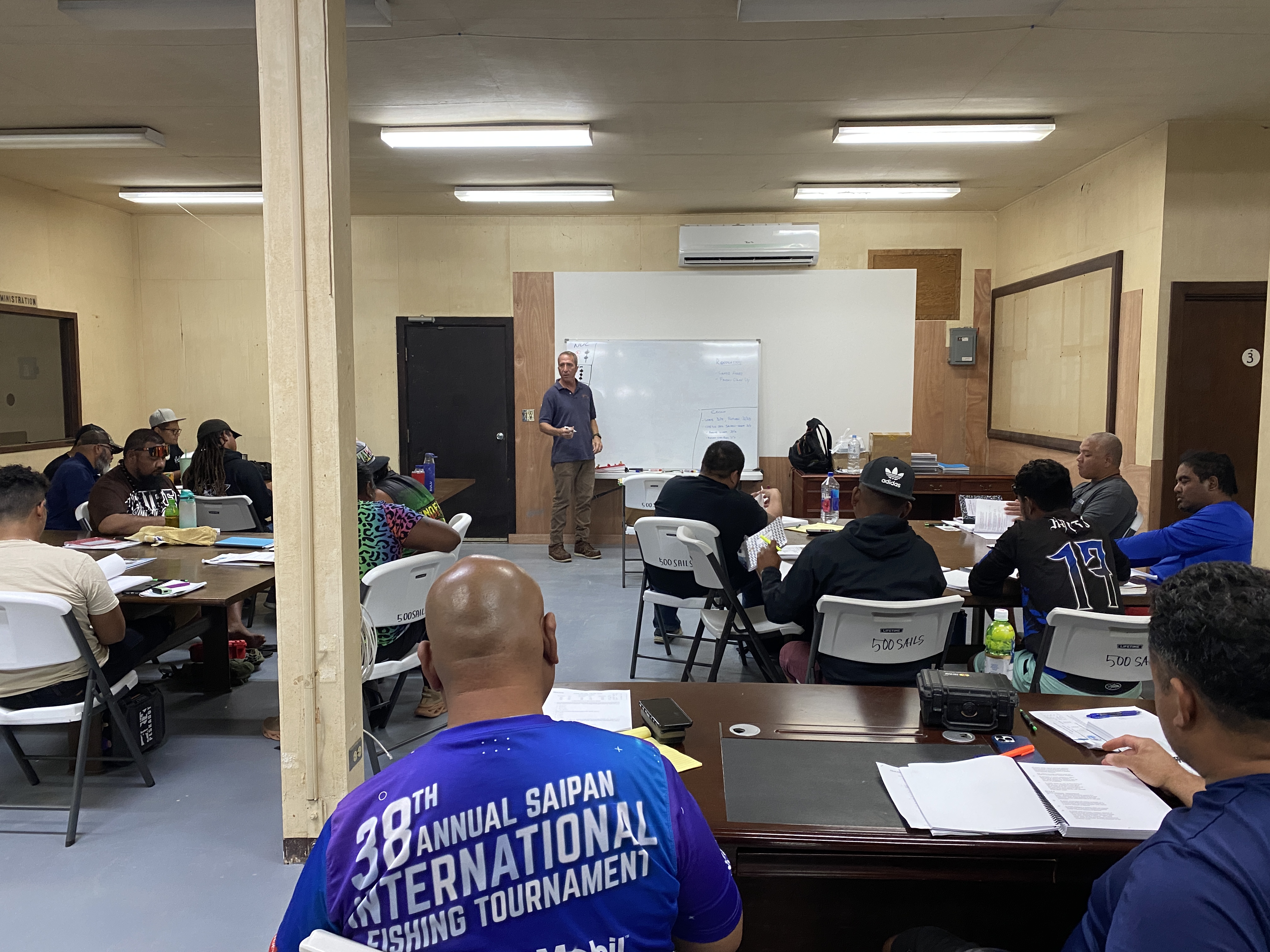 Chris Adams conducts an operator of uninspected passenger vessel or OUPV class at the 500 Sails Cultural Maritime Training Center in Lower Base.