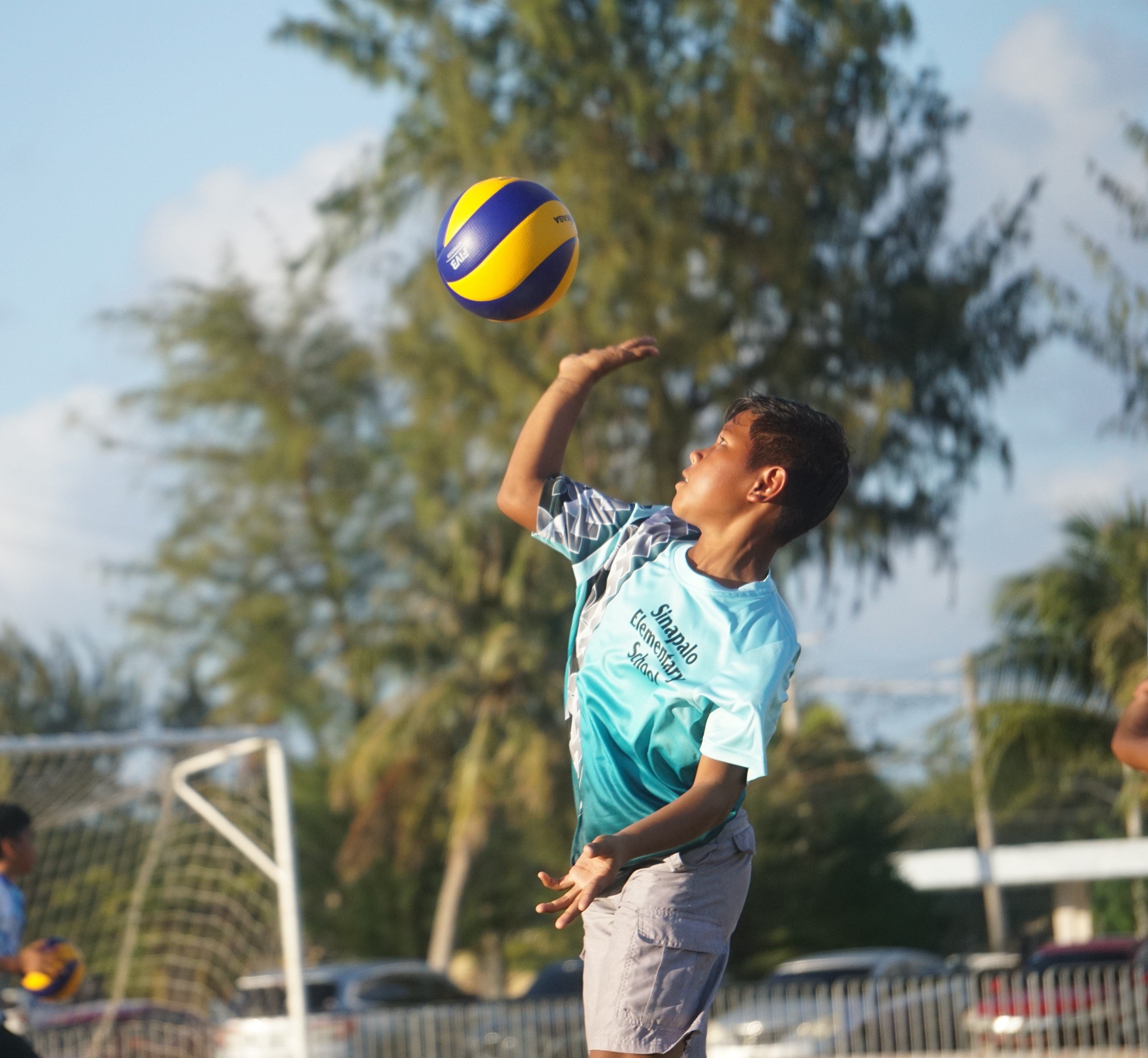 A Rota Sinapola Elementary School 1 player attempts an overhead serve during a co-ed elementary school division game of the NMIVA-PSS Interscholastic Volleyball League SY23-24 at the Oleai Sports Complex on Friday.